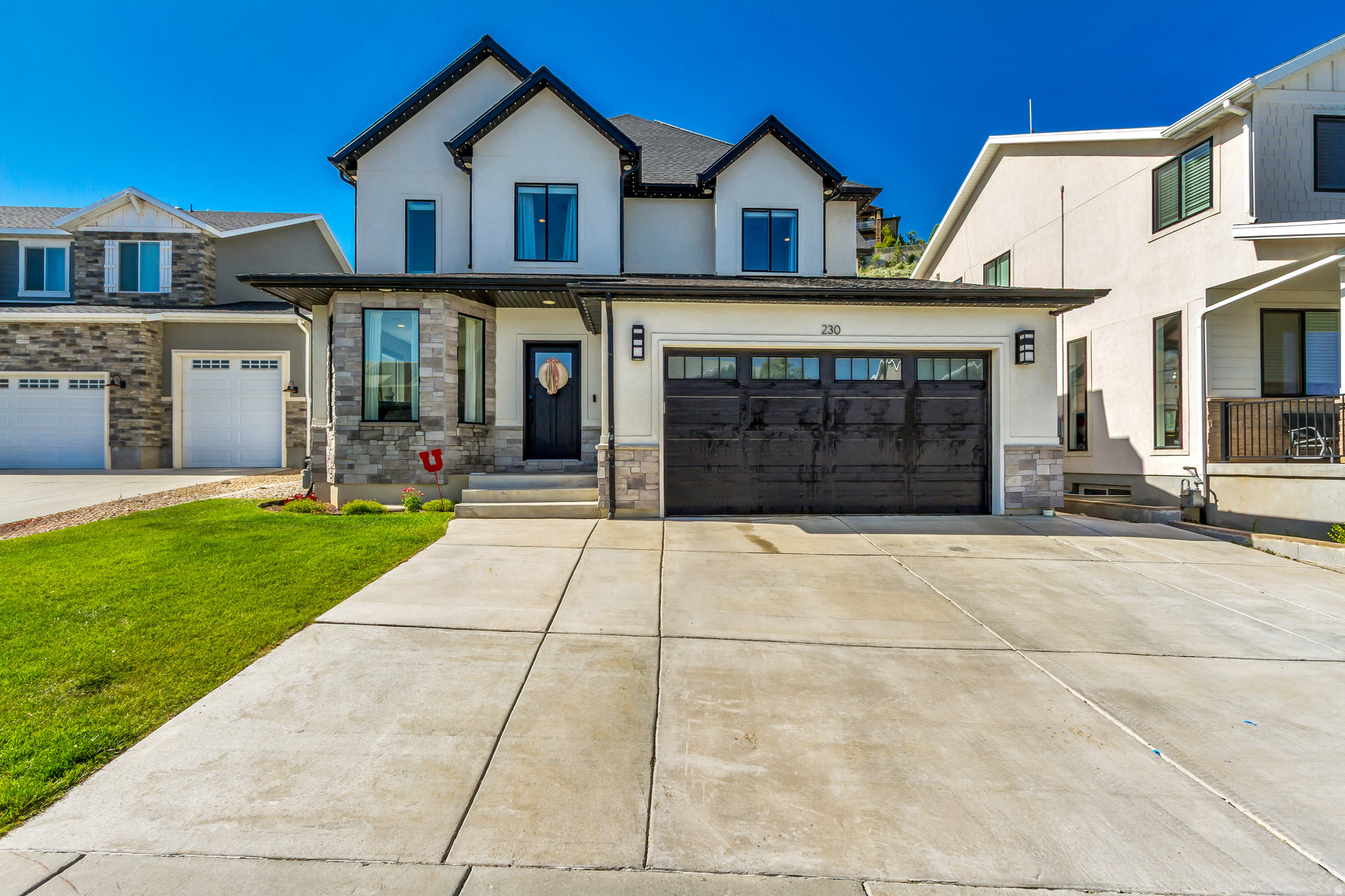 Perched in the hills with breathtaking views, this custom 2021-built gem offersthoughtful upgraded modern living space. 8-minutes from the heart of salt lake, the chef's kitchen boasts dual dishwashers, double wall ovens, a gas range, and a built-in water station. Vaulted ceilings, granite countertops, and LVP flooring complete the space. Every room is wired for cable and internet, the laundry room features custom basket storage, and the bathrooms include built-in towel and jewelry storage. The garage offers dedicated storage systems and an in-garage hose spigot for added convenience.  Unwind on the primary bedroom balcony, in your sauna or gather around the backyard fire pit making the most of your hillside views in the evenings. The fully finished mother in law apartment with its own entrance is perfect for extended family or rental income. Square footage figures are provided as a courtesy. Buyer is advised to obtain an independent measurement.