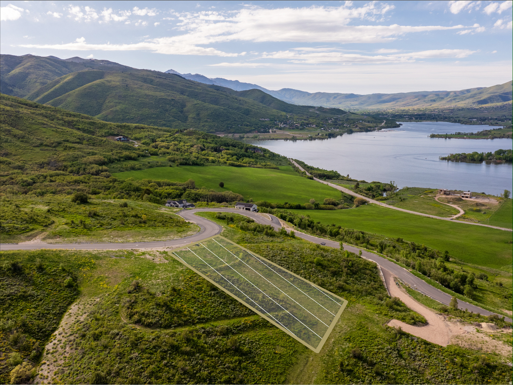 Set on 2.28 acres within the prestigious Legacy Mountain Estates, this exceptional homesite showcases sweeping panoramic views of the lake, valley, and surrounding peaks. Ideally situated between the world-class Snowbasin Resort and the picturesque Pineview Reservoir, this sought-after community is designed to honor its stunning natural surroundings while providing unmatched access to year-round recreation. From skiing fresh powder to exploring community hiking and biking trails, or enjoying water activities just minutes away, every day invites you to fully experience the mountain lifestyle. Located in the heart of Ogden Valley, Legacy Mountain offers a rare blend of serenity and convenience, with effortless connections to both Ogden and Salt Lake City. Fully improved and ready for your custom estate, this premier lot provides an extraordinary setting to build a luxury mountain retreat in one of northern Utah's most breathtaking landscapes. All property information, boundaries, and documents to be verified by buyer.