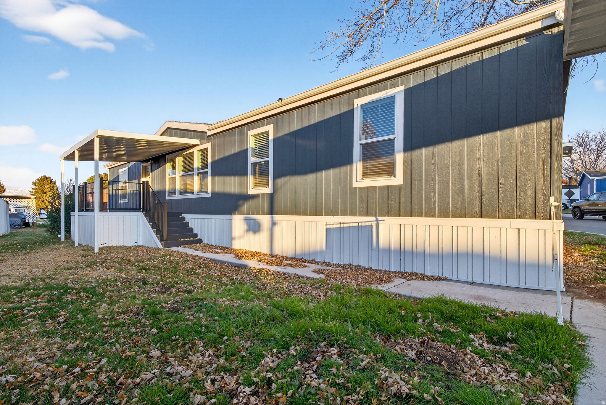 Beautiful 3-bedroom, 2-bath manufactured home in the brand new Wasatch Ranch Community in Pleasant View. This home features fresh interior finishes, LVP flooring, a spacious living room, and a stunning kitchen with upgraded cabinetry and stainless steel appliances. The primary suite includes a walk-in closet and double-sink vanity, with three additional bedrooms offering great flexibility. Enjoy a large private deck, covered parking, and a move-in-ready feel throughout. Carport, awnings, and xeriscaping are all included, saving the buyer additional expense and making this home truly 100% move-in ready. Wasatch Ranch will offer brand-new amenities and an affordable, modern community in a highly desirable location.   Square footage figures are provided as a courtesy estimate only and were obtained from model description. Buyer is advised to obtain an independent measurement.