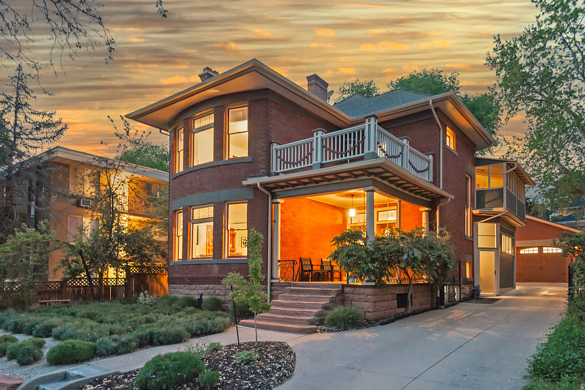 Nestled in the cherished Avenues, this beautifully updated historic home blends timeless architecture with the comfort and efficiency today's buyers crave. Boasting 5 bedrooms and 4 full bathrooms, it sits on a solid foundation of exceptional bones and thoughtful upgrades throughout. The heart of the home is the expansive primary suite, a true retreat that features a cozy fireplace, a private sitting room, an updated en-suite bathroom, and attached laundry quarters for ultimate convenience. The kitchen received a full update in 2022, showcasing all-new appliances and a professional-grade Wolf induction cooktop. It flows gracefully into inviting living and dining spaces warmed by two gas fireplaces, creating a welcoming ambiance for daily life and entertaining alike. Recent improvements include fresh interior paint and refinished floors, along with paid-off solar panels that enhance energy efficiency. Modern comfort is evident in every detail: EV charging in the garage, motorized blinds in the living room, dining room, kitchen, and primary bedroom, and a dependable forced-air heating system with central air Conditioning. The basement expands the possibilities with a full mother-in-law suite complete with kitchen and laundry hookups, adding versatility for guests or extended family. Outdoor living is equally impressive, with two second-floor decks offering elevated views and private outdoor escape routes. Step outside to a private backyard oasis featuring a paver patio, a swim spa, and low-maintenance landscaping sustained by a full drip irrigation system. The front yard welcomes you with fragrant lavender in bloom, setting a tranquil tone as you arrive home. A detached oversized garage, gated full driveway, and move-in-ready condition complete the package, inviting you to enjoy all the Avenues lifestyle has to offer.