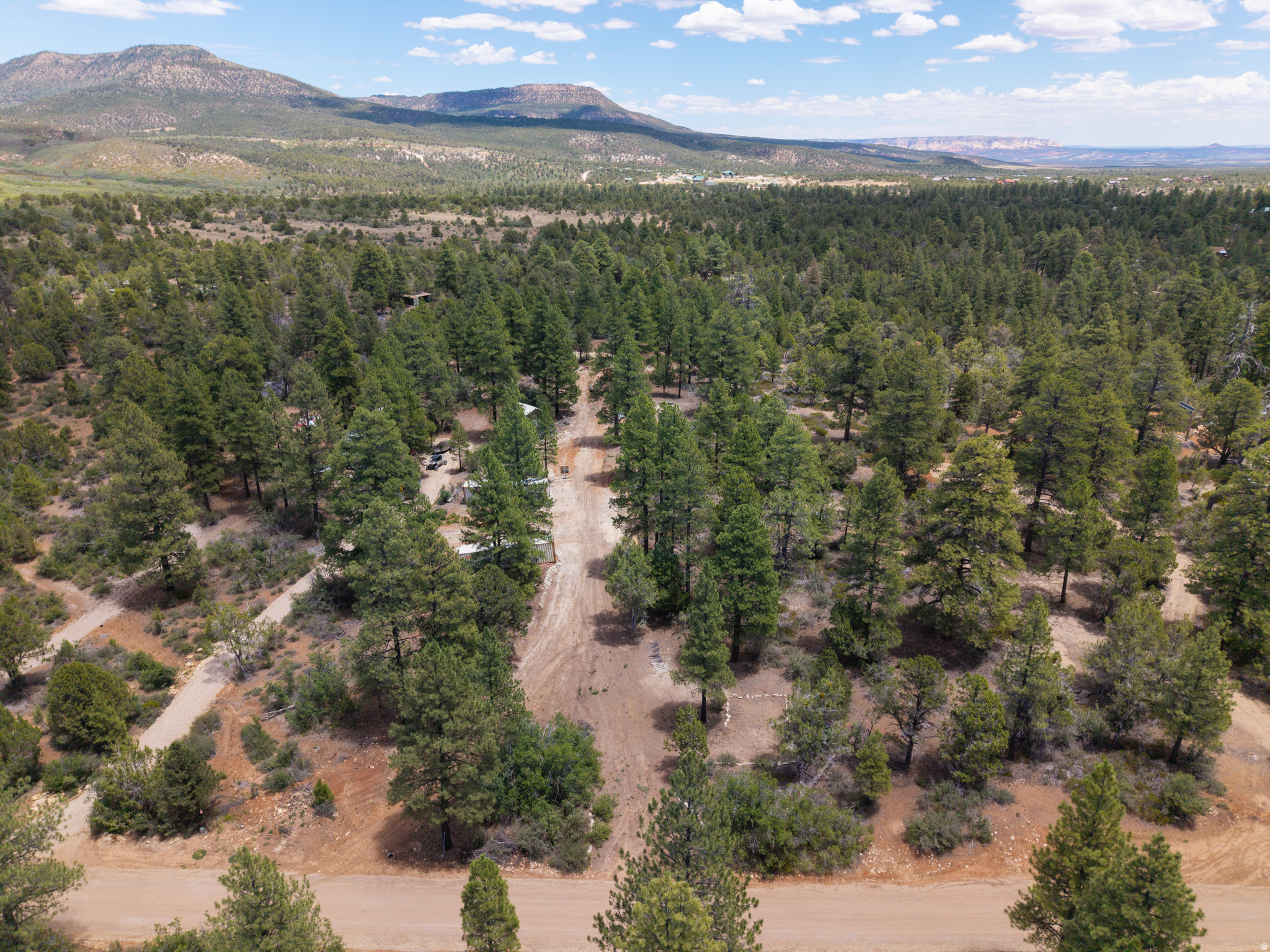 Escape to the quiet side of Zion with this 1.28-acre lot on the park's scenic east side. Mostly flat and already cleared, this property is build-ready and waiting for your vision.  Located just 20 minutes from Zion's East Entrance and only 15 minutes from the new visitor center currently under construction, you'll enjoy easy access to one of the most breathtaking national parks in the country while staying away from the crowds and congestion of the main gateway towns.  Power and water are already on the lot - a rare head start that saves you time and money. A septic system will need to be installed. There are 2 forty foot container boxes that are included in the sale.   Whether you're dreaming of a custom cabin, a weekend getaway, or a place to park your RV under the stars, this lot offers the flexibility to make it yours. The location is also ideal for a short-term rental or Airbnb investment, with strong demand from travelers seeking a basecamp near Zion.  Wide-open skies, red rock country, and the serenity of southern Utah await. Opportunities like this near Zion don't last - schedule your visit today. Buyer to verify all
