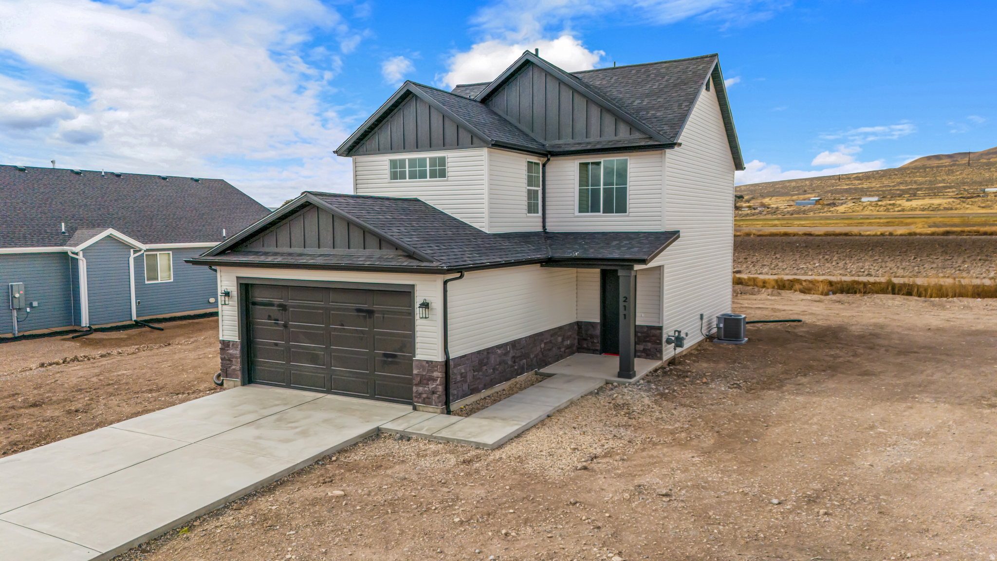 Experience the perfect blend of peaceful rural living and modern comfort in this beautifully finished 3 bed, 2.5 bath two-story home built in 2024 in Garland, Utah. Nestled in a quiet country setting while still being conveniently close to everything you need, this home offers the best of both worlds. Inside, you'll find stunning custom hardwood cabinetry, upgraded countertops, a spacious primary suite with a double sink vanity and tiled walk-in shower, plus countless thoughtful upgrades throughout. With quality craftsmanship, a functional layout, and a warm, inviting feel, this home is one you'll truly love coming home to. Reach out to hear about our incentives with our preferred lenders!