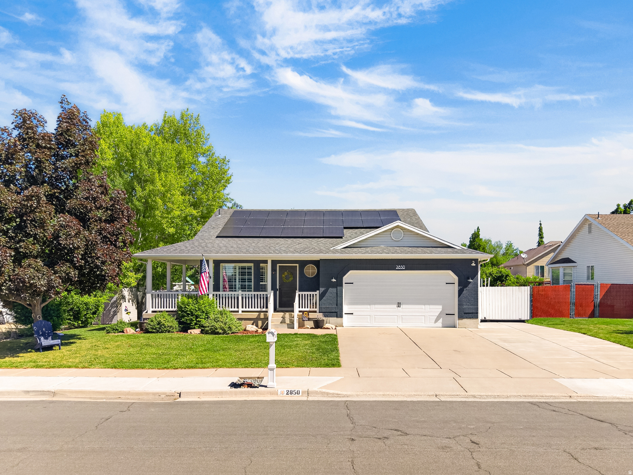 Introducing this 6 bedroom, 2.75 bathroom standout rambler in Layton. Featuring multiple upgraded finishes throughout, vaulted ceilings and a 100% finished basement, it's truly move-in ready. This 2,886 sq ft home has a balanced layout with 3 bedrooms and 1.75 bathrooms on the main level and 3 bedrooms and 1 bathroom in the basement. Each level offers a functional layout with great gathering spaces. You're sure to make great use of the newly added basement kitchenette for yourself or while entertaining guests. Its exterior includes a beautiful covered wraparound front porch, mature trees and good sized yard for quiet comfort.  You'll find yourself situated in a prime location for top-rated Davis county schools (Sand Springs Elementary, Legacy Jr. High, and Layton High), quick access to multiple parks, trails, I-15, the West Davis Corridor, shopping, entertainment and dining. Along with no HOA, and paid off solar for added energy efficiency, you'll find this is an unmatched opportunity.  Square footage figures are provided as courtesy estimates only and were obtained from county records. Buyer is advised to obtain an independent measurement.