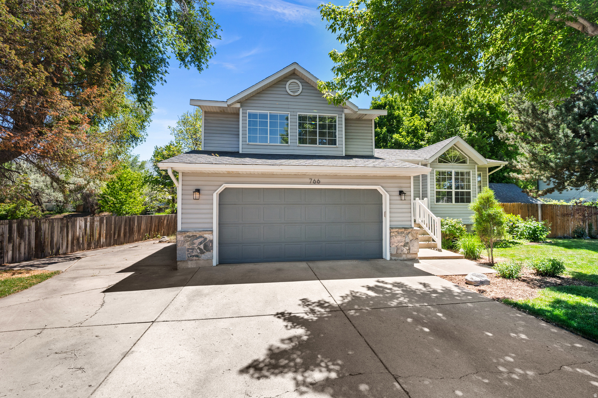 Beautifully updated Layton home backing directly to North Fork Holmes Creek! Enjoy the peaceful sound of the creek from the secluded backyard and spacious covered patio deck-perfect for relaxing or entertaining in every season. Open floor plan with vaulted ceilings creates a bright and inviting atmosphere & plenty of space for gathering and everyday living. This home combines modern updates, comfort, and a serene setting you won't want to miss!