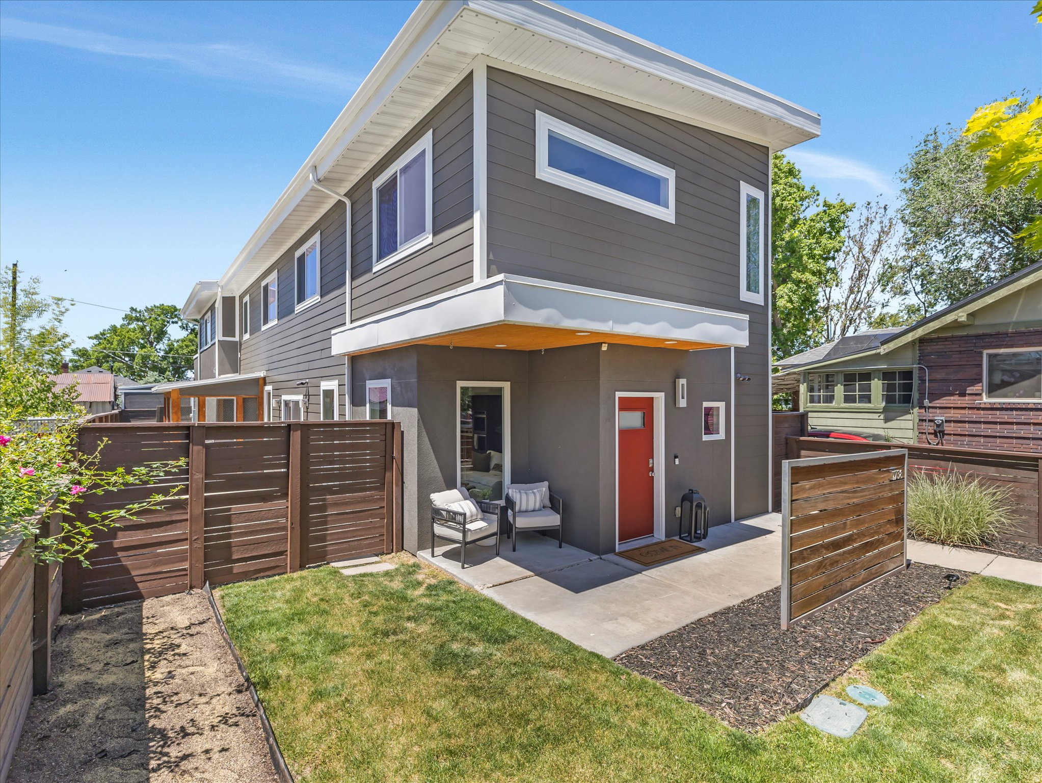 Perfectly blending modern design, thoughtful upgrades, and an unbeatable location, this sleek contemporary home is ideally situated in one of Sugar House's most sought-after neighborhoods. Just a short walk from the famous Sugar House business district, you'll enjoy easy access to popular shops, restaurants, and cafs, as well as the S-Line, Sugar House Park, Fairmont Park, and Parley's Trail. Built in 2013, this carefully designed home features an open-concept layout with a bright, inviting aesthetic accented by large sun-filled windows, hardwood floors, tall ceilings, recessed lighting, clean architectural lines, and stylish upgraded finishes. Recent updates include a new metal roof, new windows, and new interior and exterior paint. At the heart of the home is the gourmet kitchen, perfect for cooking, entertaining, and gathering. It is well appointed with quartz countertops, ample custom cabinetry, a walk-in pantry, stainless steel appliances, a double oven, a gas range with a range hood, and a stylish tile backsplash. The large center island, illuminated by pendant lighting, provides additional seating and workspace. The main floor also offers a spacious great room, a dining area that opens to the patio, a half bathroom, and a unique spa-inspired wellness room. This versatile space features an oversized shower and a cold plunge and could also function as a mudroom, pet washing station, or private spa area. As a bonus the seller is including a sauna to enhance the wellness possibilities. Upstairs is finished with newer wool carpet and the well-designed layout includes all four bedrooms and the laundry room. Windows throughout the upper level frame beautiful mountain views. The grand primary suite boasts vaulted ceilings, abundant natural light, a private balcony, and a generous walk-in closet. The luxurious ensuite bathroom offers a soaking tub, a double vanity, sleek tile finishes, a large walk-in shower, a private commode room, and a new sliding barn-style door. Step outside to a private, fully fenced yard featuring a lush lawn, a patio for outdoor dining, a front sitting porch, flower beds, a new sprinkler system and a completely enclosed dog or cat run. Major system upgrades include a new tankless water heater, new water filtration system, water softener, high end air filtration system, new AC unit, a video security system, new Jellyfish accent lighting, a 5.2 sound system installed in the ceiling of the living room, sauna, and cold plunge areas. Park cars or bikes in the spacious two-car garage equipped with a new garage door opener, new epoxy coated floor and a BMW EV charger. You can store your extra gear in the newly painted backyard shed. This premium Sugar House address is also conveniently located near the University of Utah, Westminster University, downtown Salt Lake City, Liberty Park, world-class ski resorts, and the Salt Lake City International Airport.