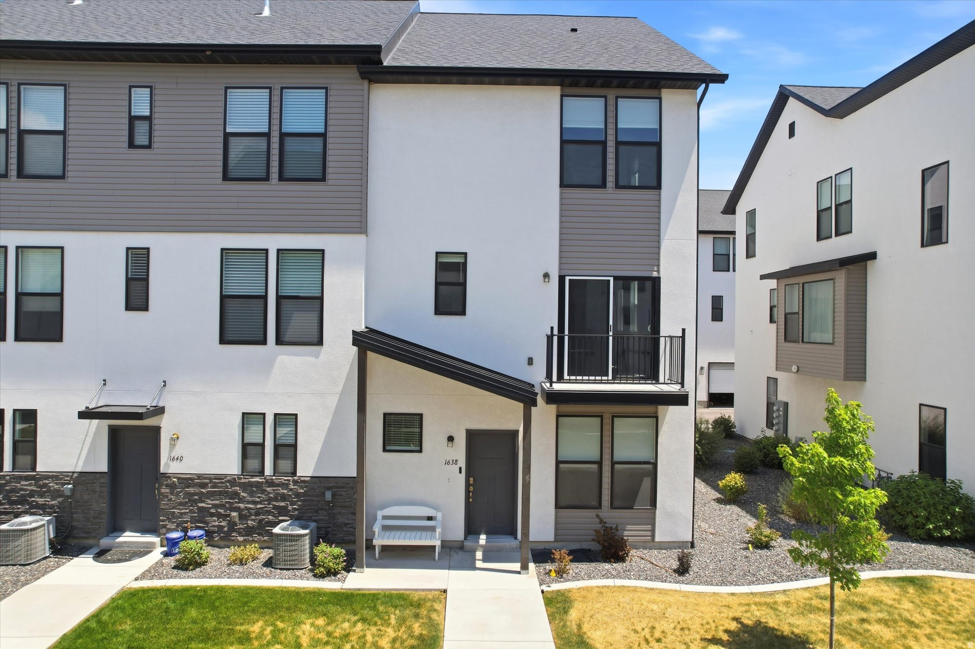 Welcome home to this beautifully designed townhome featuring a spacious open-concept floor plan that's perfect for both everyday living and entertaining. Ideally located with stunning mountain views and convenient freeway access, you'll enjoy being just minutes from shopping, dining, and recreation. The home offers five bedrooms, stylish white cabinetry, granite countertops, and durable luxury vinyl plank flooring throughout the main living areas. With its thoughtful layout, modern finishes, and exceptional location, this home is one you won't want to miss.