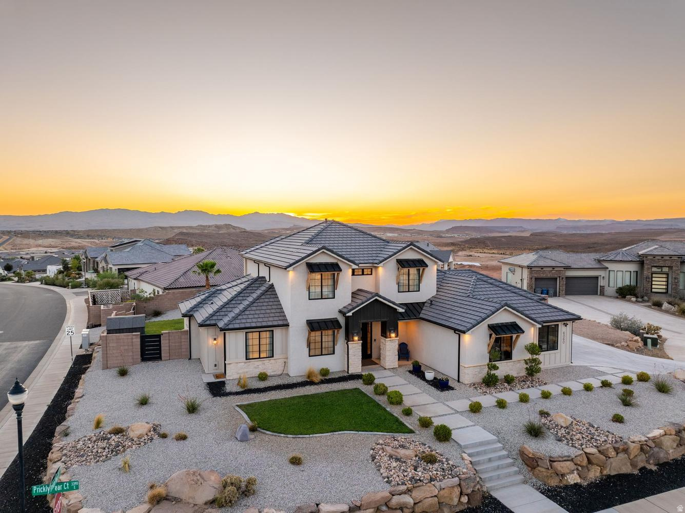 Do peaceful morning swims, afternoon splash parties, and backyard BBQs sound like your kind of lifestyle? From the moment you arrive, it's easy to picture life here. Set on a generous corner cul-de-sac lot, this beautifully maintained home embraces the Southern Utah lifestyle with inviting indoor spaces and an exceptional backyard designed to be enjoyed. The privately fenced backyard features a generous covered patio, an impressive 8-foot-deep salt water pool, and spa--each with its own dedicated heater so they can be enjoyed independently. The custom rock slide was thoughtfully engineered so every ride lands exactly where it should...in the water. Natural light bathes the living spaces designed for both gathering and quiet retreat. The comfortable floor plan is complemented by a dual-zone HVAC system, allowing the main level and upstairs to be heated and cooled independently for year-round comfort. The cheerful kitchen is beautiful & functional, featuring an expansive island, hidden walk-in pantry, gas cooktop, & abundant cabinetry. Permanent Exterior Lighting, No HOA. Located just minutes from excellent schools, shopping, dining, golf, hiking and biking trails, Sand Hollow, Quail Creek, and everyday conveniences, this home offers the lifestyle people move to Southern Utah to enjoy.