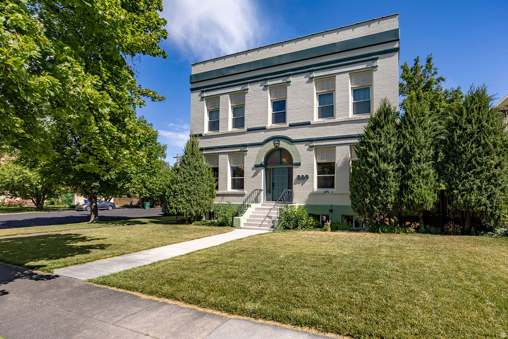 Own a part of Logan's history in this beautiful brick building originally constructed by Union Knitting Mills in 1910.  Building was converted into 3 condominiums in 1979.   This unit is on the main level and has large living areas with high ceilings, plenty of windows, 3 bedrooms and 2 bathrooms.  There is a one car attached garage and a well sized storage room in the back common area (second door on the right).  The exterior is in mint condition, full of character and charm and each unit has a fence, a locked storage room, and a private patio area for outdoor living.  Enjoy the convenience of walking downtown in just minutes.  Vacant and easy to show.  Buyer to verify all information.