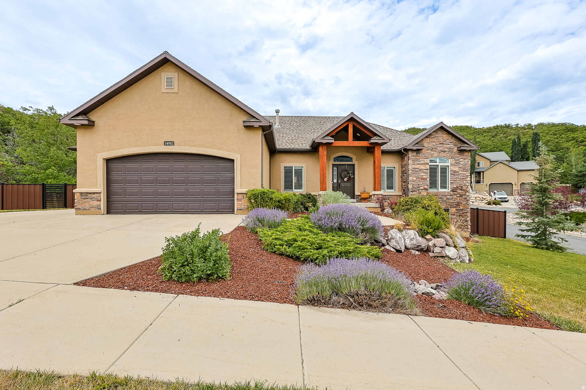 Welcome to single-level living in the highly sought-after SunCrest community! Nestled on a peaceful, private 0.71-acre lot, this beautifully updated rambler offers stunning views, exceptional privacy, and a lifestyle you'll love.  The backyard is designed for relaxing and entertaining with water-wise landscaping, a custom fire pit, and new fencing. You will enjoy watching the wildlife from your oasis. An energy-saving whole-house attic fan cools the home in minutes, helping reduce air conditioning costs during the summer.  Recent updates include new kitchen appliances, water heater, water softener, fresh paint, and new carpet, making this home truly move-in ready.  Enjoy SunCrest's outstanding HOA amenities, including a community pool, clubhouse, fitness center, parks, playgrounds, tennis and pickle ball courts, plus year-round community events. Miles of scenic hiking and biking trails are just outside your door, and the home is located within a highly rated school district.  Experience the perfect combination of privacy, breathtaking surroundings, and an active mountain community in one of Draper's most desirable neighborhoods.