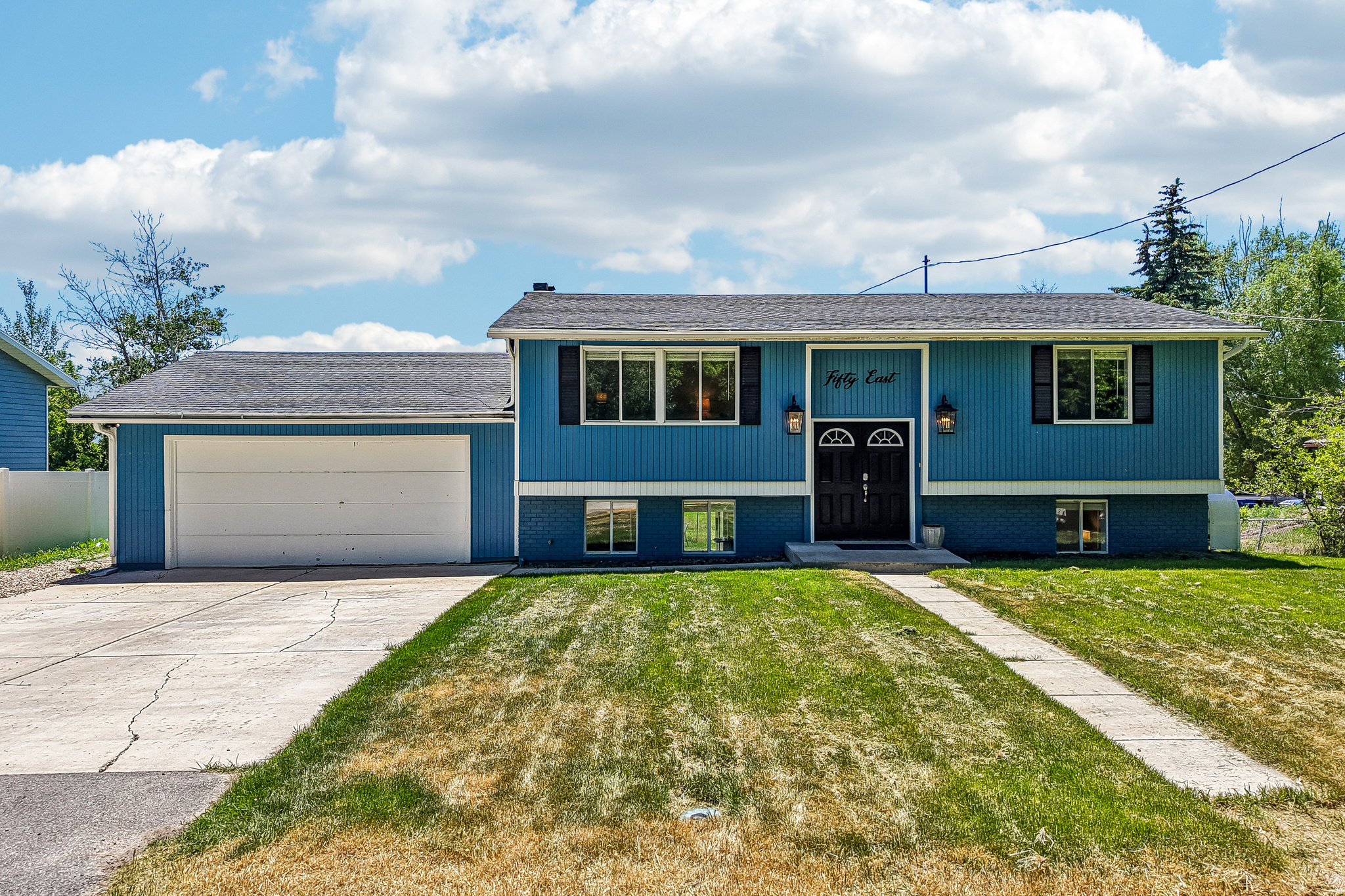 Experience the best of Wasatch County living in this beautifully maintained 4-bedroom, 2-bathroom home located on a peaceful street in Midway. The bright and inviting upper main floor layout features an updated kitchen highlighted by granite countertops, modern appliances, and seamless natural light.  The fully finished walk-out basement includes a second fully equipped kitchen, offering a seamless setup for multi-generational living, ADU rental, or distinct separate living quarters. Step outside to enjoy spectacular, panoramic mountain vistas from the open backyard patio. The 0.17-acre lot is fully fenced and beautifully landscaped with mature trees, providing excellent outdoor space. Complete with an attached garage and a location just minutes from local dining, golf courses, and world-class ski resorts, this turnkey home is an absolute must-see! Mortgage savings may be available through the listing agent's in-house lender; ask for details.