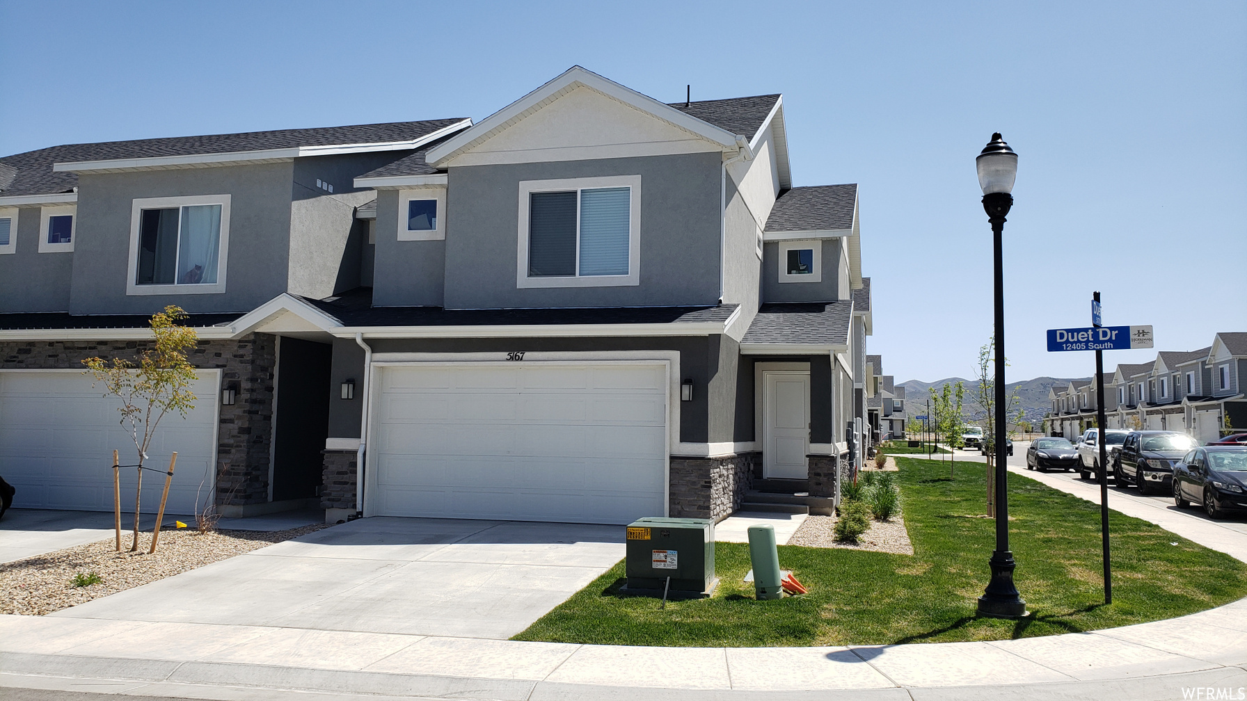 OPEN HOUSE SATURDAY, 7/11/26 from 11:00 am to 1:00 pm.  Stunning, meticulously maintained end-unit townhome in Herriman offering over 2,200 sq. ft. of pristine living space! Enjoy extra privacy with no west-side neighbors. The bright, open-concept main floor features stylish cabinetry, a spacious kitchen with a large island and bar seating, a generous informal dining area, and laminate flooring. Refrigerator, washer, and dryer are all included!. Upstairs, retreat to oversized bedrooms, including a grand primary suite with dual closets and a massive second bedroom with an extra-large walk-in closet. The 99% fully finished basement provides incredible flexibility, featuring a spacious 4th bedroom  (or a great family room) and a convenient kitchenette equipped with a sink, fridge, and custom cabinets. Additional features include an attached 2-car garage with hanging storage and a built-in radon mitigation system. Unbeatable location near shopping, Mountain View Corridor, Herriman Rec Center, the library, and top schools like Salt Lake Academy. Plus, it's only a 7-minute drive to Mountain View Village Mall and a quick 8 minutes to the new Ballpark at America First Square (home of the Salt Lake Bees)! Square footage figures are provided solely as an estimate and are based on county records; buyers are advised to obtain an independent measurement.   Buyer to verify all.
