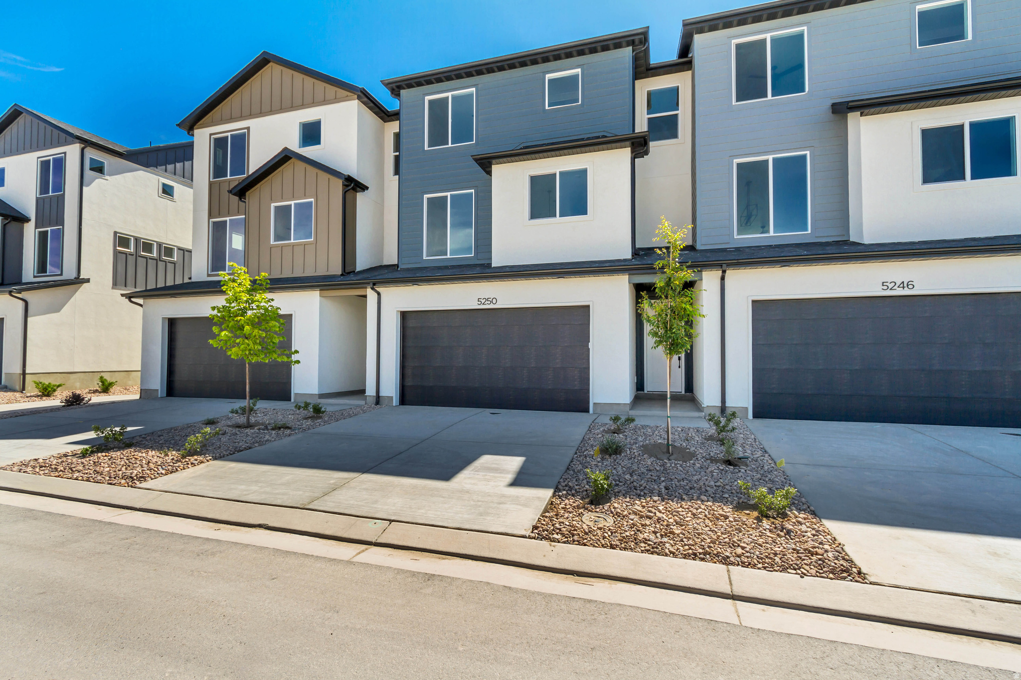 Designed for buyers who want lasting value without paying for a long list of upgrades, this thoughtfully crafted 3-story townhome offers 3 bedrooms, 2.5 bathrooms, and a deep 3-car garage with exceptional storage that's difficult to find in this price range. The layout is designed around the way people actually live. The main living level feels open and inviting with 9' ceilings, 8' doors, oversized windows, and contemporary finishes that create a bright, comfortable gathering space. The kitchen is equal parts style and function, featuring quartz countertops, 42" custom cabinetry, soft-close dovetail drawers, pull-out shelving, dedicated storage solutions, premium Moen fixtures, and LG appliances. Upstairs, the primary suite offers dual closets and a beautifully finished bathroom with quartz countertops, double vanity, semi-Euro glass shower, and thoughtfully selected finishes carried throughout the home. Built with longevity in mind, Above-Standard Features include a 95% efficient Lennox furnace, 14-SEER A/C, Wi-Fi thermostat, EV charging rough-in, Kwikset smart lock, LiftMaster MyQ garage system, Cat-6 wiring, and numerous additional electrical upgrades already included. Finished with Amsco windows, durable stucco, and James Hardie accents, this home combines modern design, everyday functionality, and long-term value. Compare what's included-you'll quickly see this home delivers far more than buyers typically expect at this price point.   Square footage figures are provided as a courtesy estimate only and were obtained from builder plans.  Buyer is advised to obtain an independent measurement.