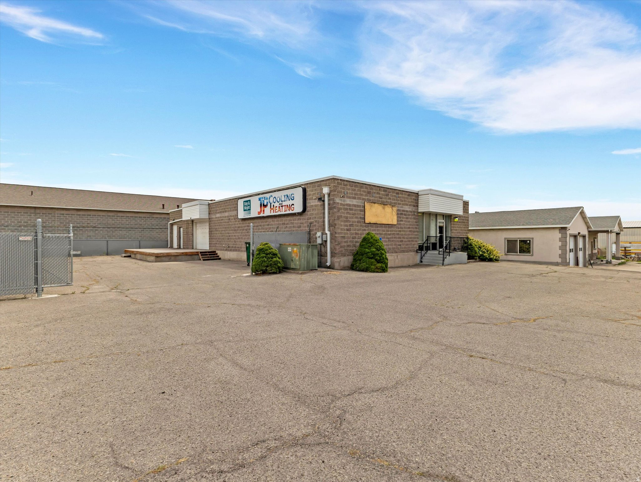 6,290 sq ft building on .44 acres with bountiful parking and a secure, private fenced yard.  This versatile building boasts 4,000sf on the main floor and 2,290sf in the basement.  Zoned M2, which allows many commercial, industrial, and retail uses.  Orem Land Use Table attached.  Single Phase, 200AMP Power with three-phase capability ready.  Current configuration includes 1,350sf of newer office space (lobby, three private offices, and conference room), two bathrooms, laundry, and breakroom.  The remaining footage on the main floor is improved general use space, which has a 12'x8' and 6'x8' garage doors leading out the large loading dock.  The basement is accessed by secure safe doors, with a third safe door dividing the basement in half.  Basement is prime for storage or manufacturing.   New Roof in 2021.  All three HVACs newer (2020, 2021, 2024).Incredible owner/operator or investor opportunity.  Buyer is advised to verify all.