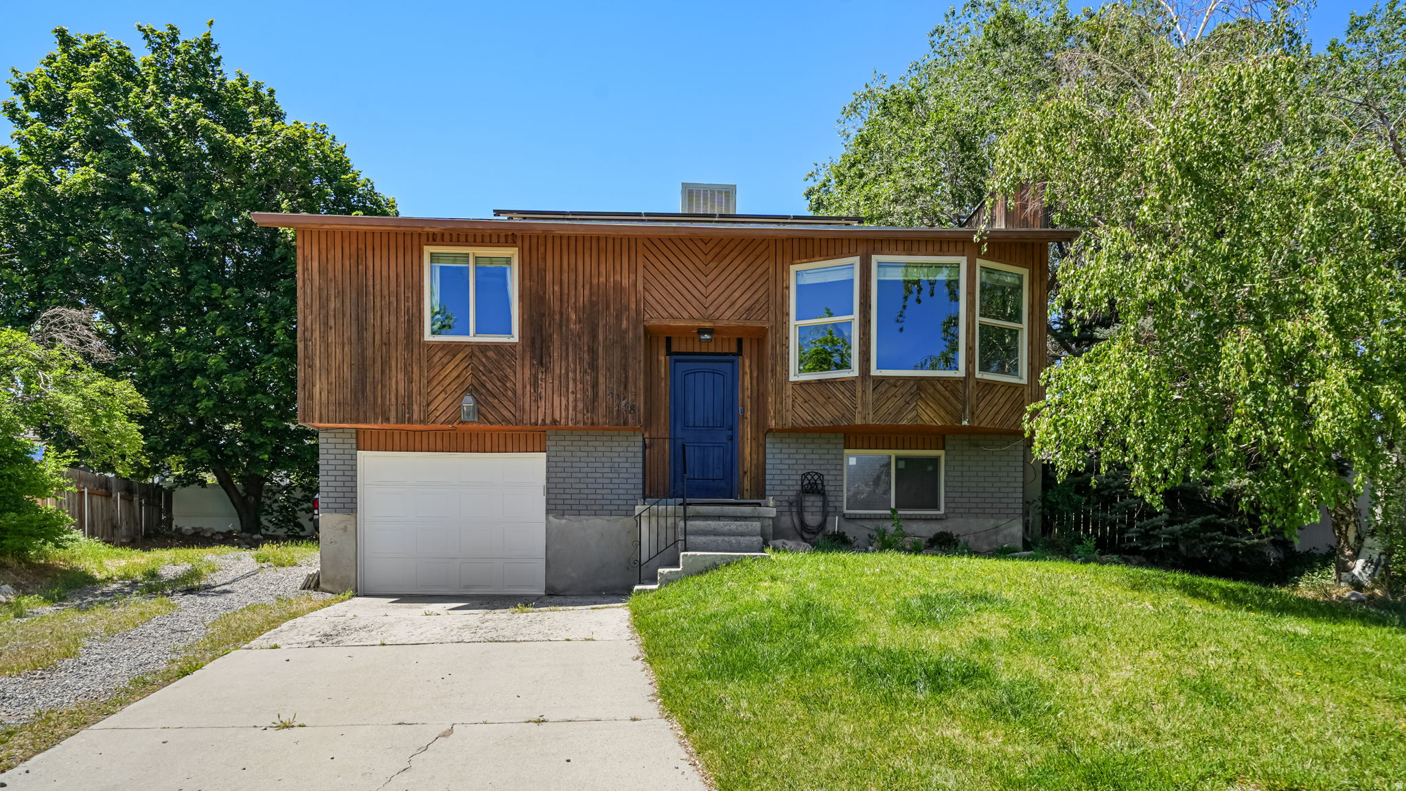 Single family home in SLC for less than $430k! Gorgeous cul-de-sac location on a hill with unobstructed views of the Cottonwoods. New carpet, fresh paint, and a remodeled bath are highlights that make this home move-in ready. Roomy kitchen with gas range, ample counter space with breakfast bar, and updated appliances. Furnace, A/C, and water heater all replaced within 5 years. Oversized attached garage. Out back: a large new deck, fire pit area, storage shed, extra parking, and a fully fenced yard built for entertaining.
