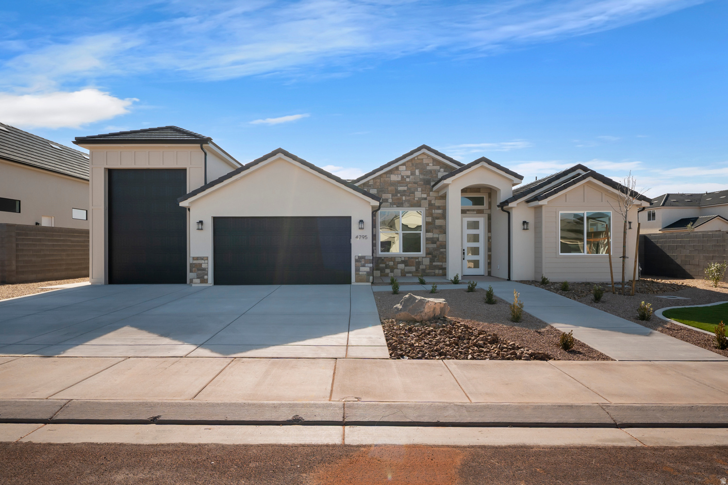 Welcome to this stunning new construction, single-level home perfectly positioned in the heart of Southern Utah's recreation paradise. Featuring 4 spacious bedrooms plus a versatile flex room and 3 full bathrooms, this thoughtfully designed floor plan blends luxury, comfort, and functionality. Step inside to discover high-end LVP and tile flooring, rich dark wood cabinetry, and sleek quartz countertops throughout. The open-concept living area is anchored by a cozy gas fireplace, creating the perfect gathering space after a day of adventure. A butler's pantry adds both style and practicality, ideal for entertaining and everyday living. Car enthusiasts, adventurers, and toy lovers will appreciate the 38'7'' RV garage, offering ample space for recreational vehicles, gear, and storage.