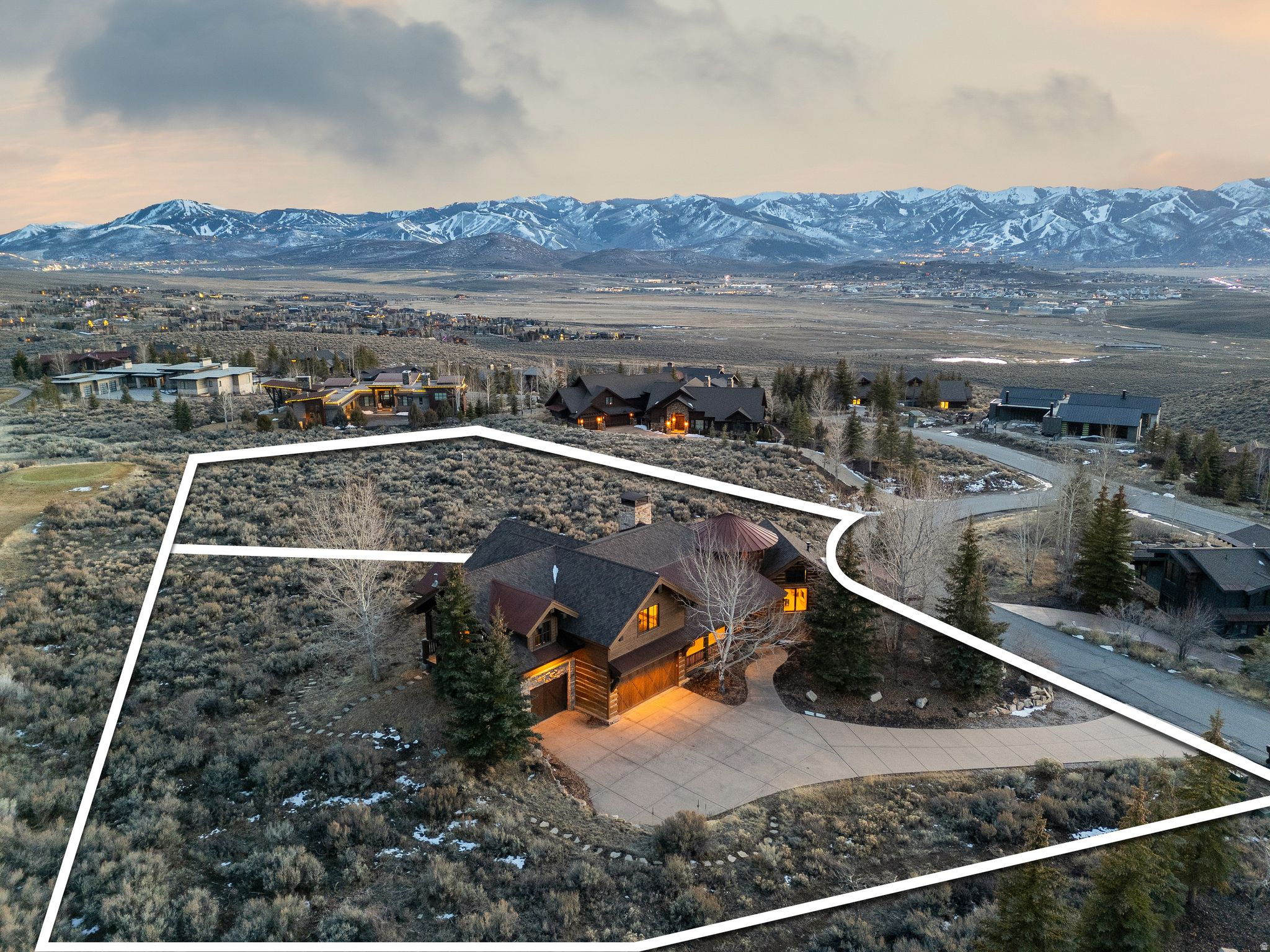 Price now includes the adjacent lot - West Hills 34 - a buildable, premium ski-view homesite. The home is offered fully furnished and turnkey, with a full Golf Membership available. Positioned on a quiet cul-de-sac in the West Hills neighborhood, the property enjoys unobstructed ski resort views spanning Deer Valley, Park City Mountain, and Utah Olympic Park. A short walk to the Main Village Clubhouse puts you at the center of Promontory's world-class amenities - from championship golf and fine dining to fitness, tennis, pickleball, pools, and programming for every generation. Designed for comfort, the main level of this home is one open space where the living room, kitchen, and dining area flow seamlessly together, creating a warm environment for everyday living and entertaining. The large primary suite occupies its own wing on the main level, offering privacy, and unobstructed ski resort views. A second ensuite bedroom is on the main level providing convenience for families and guests, and three additional bedrooms on the lower level. Some amenities include a full bar and game room, private movie theater, and a rare underground wine cellar. Additional features include a walk-in pantry, lower-level laundry, radiant heat throughout, AC, three-car garage, and a short heated driveway. Offered fully furnished and turnkey, with a Golf Membership available, this home is ready for immediate move-in and enjoyment.