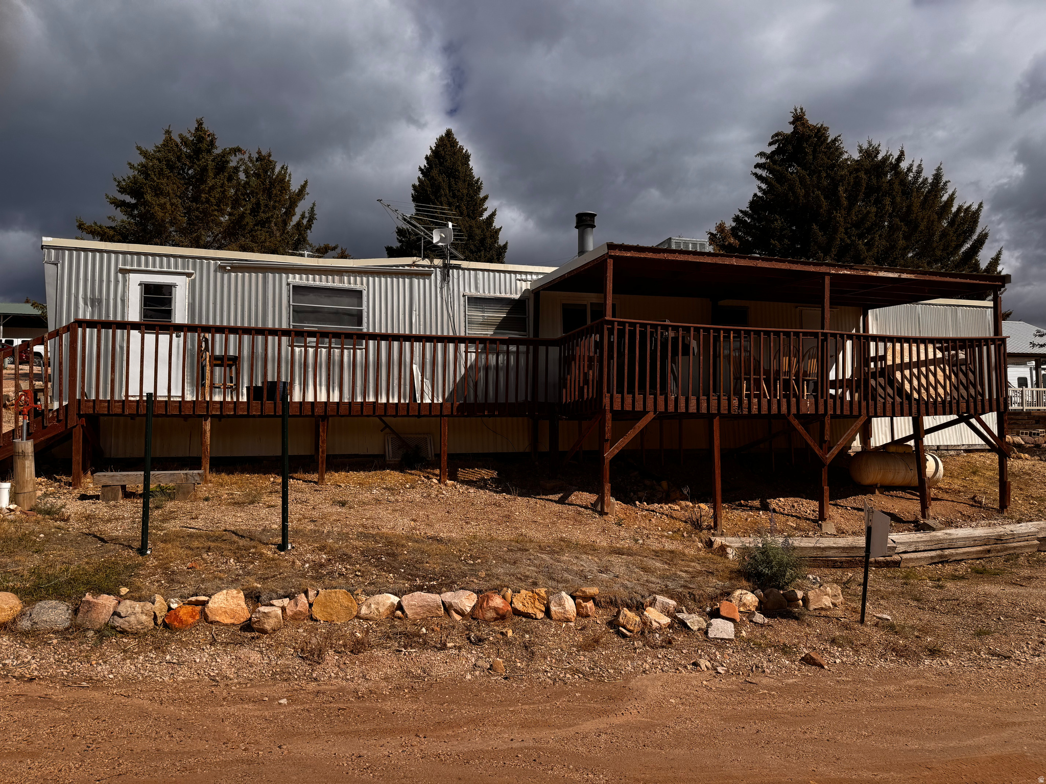 This property needs a little love but has such AWESOME potential. Wood burning stove with some newer vinyl windows. Large 10X24 south facing deck,  with wonderful views of the meadow below. Enjoy year round living or weekends at the lake. Take advantage of SELLER FINANCING on this wonderful investment.
