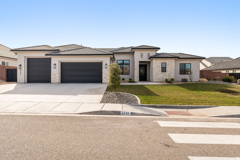 **Short Sale NOT YET APPROVED by bank** Desert Living with Space for the Toys -- Set in Desert Canyons near the Arizona line, this well-designed Jared West-built home combines open living spaces with thoughtful details throughout. Inside, 10-12 ft ceilings, 8 ft doors, and warm engineered hardwood floors create a bright, comfortable feel. The kitchen is built for both cooking and gathering, featuring stainless Bosch appliances, double ovens, quartz countertops, custom cabinetry, a large island, and a butler's pantry for extra storage and prep space. The great room stays light and welcoming with built-ins, a gas fireplace, and views into the landscaped backyard. A split floor plan adds privacy, while the oversized boat garage with epoxy floors offers plenty of room for vehicles, toys, and gear. Located just minutes from scenic hiking trails and outdoor recreation, this home delivers the space, comfort, and freedom that make Southern Utah living so appealing. No HOA.
