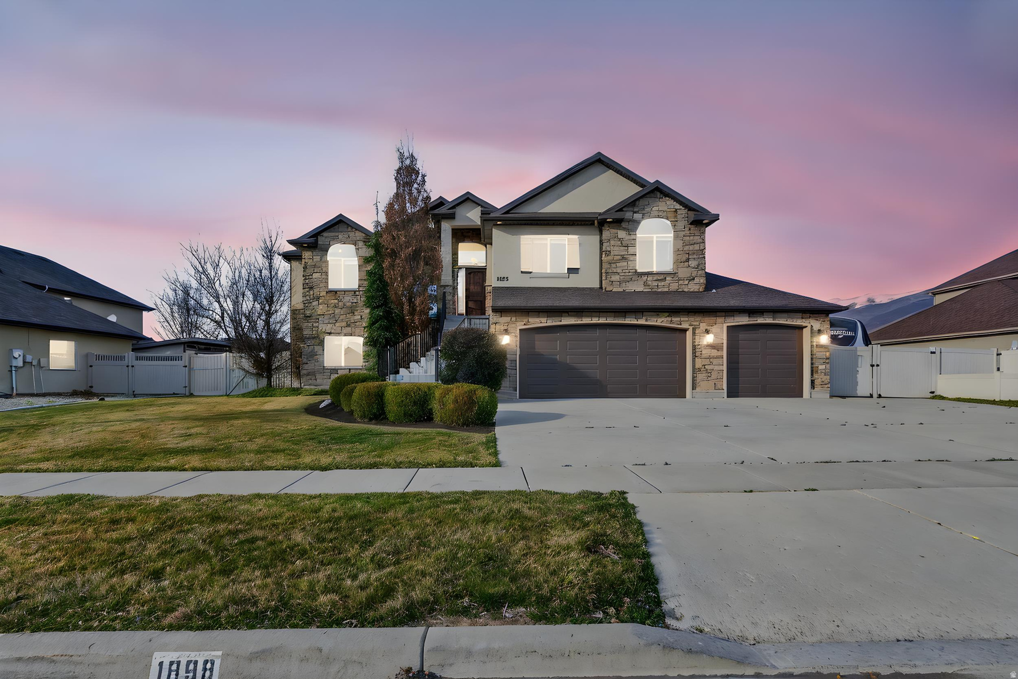 Welcome to Farmington Ranches, where spacious living, thoughtful updates, and an unbeatable location come together. Nestled on a quiet cul-de-sac, this beautifully maintained rambler offers over 3,000 square feet, 5 bedrooms, and flexible living spaces designed for both everyday comfort and entertaining.  The heart of the home is the bright, open-concept great room featuring soaring natural light, a stunning fireplace feature wall, and seamless flow into the updated kitchen. Home chefs will appreciate the oversized island, granite countertops, 5-burner gas cooktop, built-in wall oven, walk-in pantry, and abundant workspace for gatherings large and small.  The primary suite is a true retreat, complete with a private sitting area, walk-in closet, corner soaking tub, separate shower, and granite finishes. The fully finished walkout basement expands your living options with a large family room, additional bedrooms, and direct access to the covered patio, making it ideal for guests, recreation, or multi-generational living.  Outside, you'll find RV parking, an oversized 3-car garage with overhead storage, mature landscaping, secondary water, and multiple outdoor living spaces including a covered patio and private deck.  Enjoy peace of mind with extensive recent improvements, including a new roof (2026), new AC system (2026), water softener (2025), tandem water heaters (2023 & 2025), exterior paint, stucco repairs, updated trim work, outdoor lighting, and central vacuum.  Located near parks, trails, schools, and all that Farmington has to offer, this move-in ready home combines space, functionality, and value in one of the area's most desirable neighborhoods.