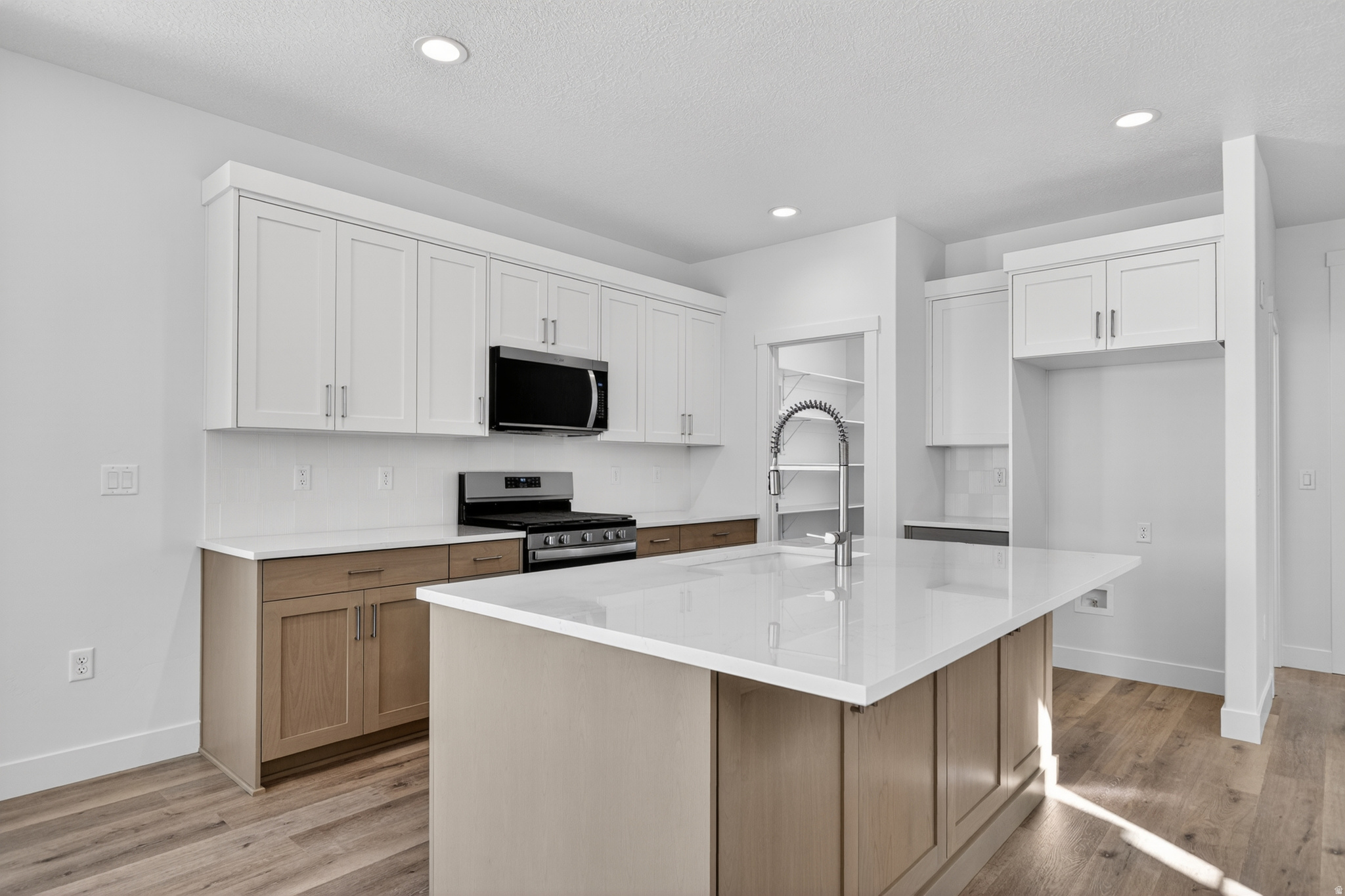 One of the last Alta floor plans left in the neighborhood and steps away from 1 of the community parks!! Loaded with features you wouldn't expect at this price point: Finished basement with 2nd washer/dryer hookup and roughed in for future kitchenette or wet bar. Huge primary suite with double vanity sinks, double door linen closet, separate tub/shower, and a WIC big enough for all your clothes and then some. Local custom cabinetry and quartz countertops throughout. No need to worry about putting in a yard, landscaping and fencing is included in the purchase. Incentives available with builders preferred lenders, call for more info.