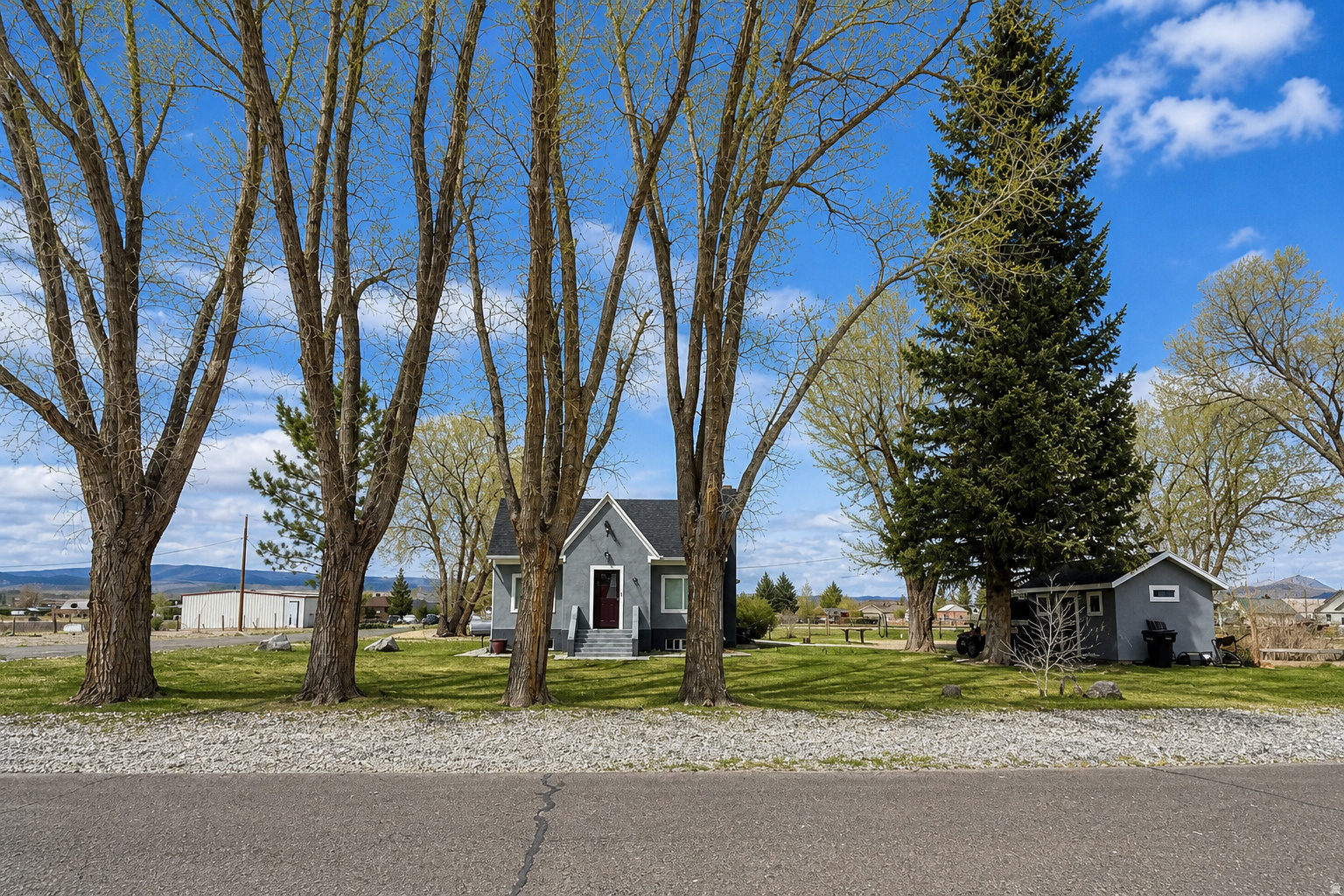 Turn-key and full of charm, this fully remodeled Loa home sits on prime horse property making it the perfect home, and it has strong potential as a short-term rental or getaway. Ideally located near Fish Lake and Capitol Reef National Park, it offers the perfect blend of lifestyle and investment opportunity. Inside, you'll find quality updates throughout, including hardwood flooring, high-end cabinetry, granite countertops, and a beautifully finished bathroom with tile surround. The layout is comfortable and functional, featuring a spacious mudroom/laundry area and an unfinished basement ready for future growth. Outside, enjoy open space, mature trees, and plenty of room for horses, animals, or equipment-ideal for those looking to embrace a rural lifestyle with flexibility.  Square footage figures are provided as a courtesy estimate only and were obtained from previous listing .  Buyer is advised to obtain an independent measurement.