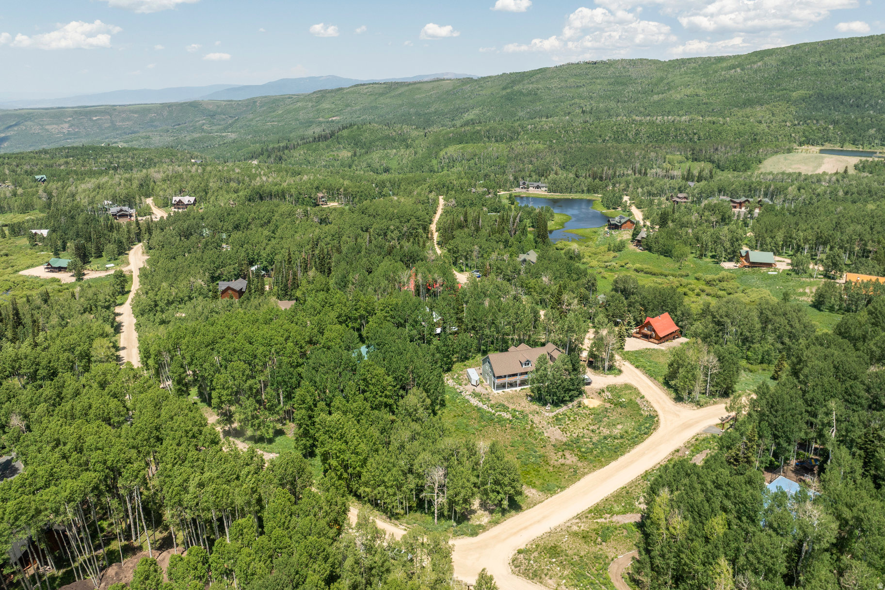Your Dream Mountain Retreat Awaits! Nestled in the serene beauty of Upper Timber Lakes, this stunning wooded lot offers the perfect setting and canvas for your dream mountain home. Surrounded by tall, graceful aspens, the lot offers a tranquil escape from the hustle and bustle of everyday life. The lot is ready to build, with plans for a modern A-frame cabin included, alongside structural plans, a site plan, septic plan, and a lot survey. Exterior and interior renderings are provided to offer a vision of your future getaway in this peaceful, wooded enclave. Lot Features & Plans: *Surrounded by mature aspen and pine trees *Modern A-frame cabin plans (exterior and interior renderings available) *Structural plans, site plan, septic plan, and lot survey included *HOA-maintained, plowed roads for convenient year-round access Timber Lakes is a private community that provides year-round access, making it the perfect place to escape in all seasons. The lot offers ample opportunity to enjoy nearby snowmobile trails, hiking paths, wildlife sightings, nature walks and lake activities. Close to downtown Heber, Midway, and Jordanelle Reservoir for boating, fishing, and water recreation. Just a short drive to Park City for world-class skiing, mountain biking, and shopping Whether you're seeking winter adventures or a peaceful summer retreat, this lot in Timber Lakes offers the ideal backdrop to build your perfect mountain escape!