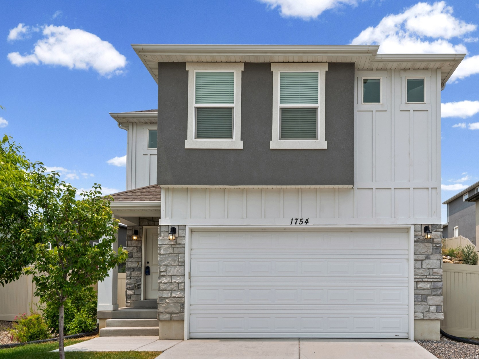 **LIKE NEW AND MOVE IN READY!** This stunning 4-bedroom, 2.5-bath home, built in 2021, combines modern finishes, spacious living, and endless potential in the sought-after Summit Ridge community of Santaquin. With a bright, open-concept layout, stylish upgrades, and an unfinished basement ready for your personal touch, this home offers everything today's buyers are looking for. The main level features durable laminate flooring, while the spacious kitchen boasts stained shaker cabinetry, quartz countertops, a large center island, and abundant cabinet and counter space. Upstairs, you'll find four generously sized bedrooms, including a spacious primary suite with a walk-in closet filled with natural light from its own window. The unfinished basement provides an excellent opportunity to customize the home to fit your needs, with space for an additional bedroom, bathroom, family room, home gym, theater, or extra storage. Step outside to a large, fully fenced backyard featuring low-maintenance artificial turf that stays green year-round-perfect for kids, pets, entertaining, or simply relaxing. Conveniently located just minutes from I-15, parks, walking trails, schools, and open green space, this home offers the perfect balance of peaceful living and everyday convenience.  Whether you're a first-time homebuyer, need more space for a growing family, or are looking for a newer home with room to expand, this exceptional property is ready to welcome you home. Schedule your private showing today!