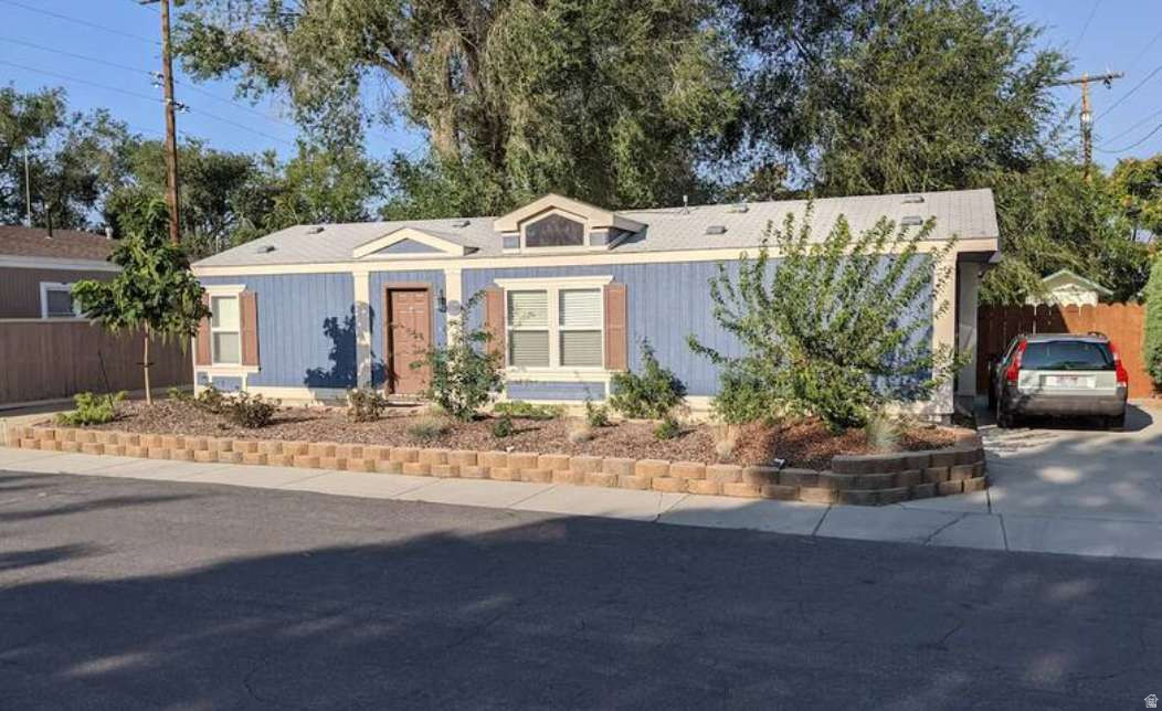 Comfortable three-bedroom, two-bath house located on a quiet street facing a park. Large, fenced backyard with several mature trees providing shade.