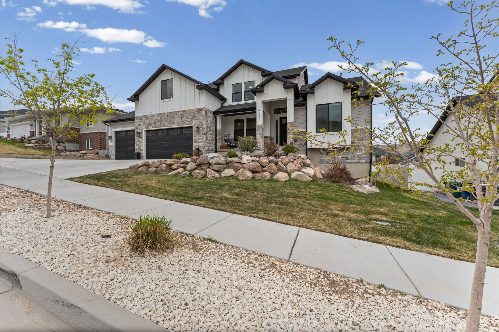 Price Improved $50k! WOW! You expect the mountain views in this location, but it's the valley views that will knock your socks off! This stunning 4-bedroom, 3-bath home offers a perfect blend of comfort and modern living. The open-concept design features a spacious living area, a contemporary kitchen with stainless steel appliances, and a generous island-ideal for entertaining. The main floor master bedroom  suite includes a private retreat with a luxurious en-suite bath and walk-in closet. The backyard provides a private outdoor space, perfect for relaxing or hosting gatherings. Additional highlights include a 4-car garage perfect for boat storage, unfinished basement(9' ceilings) waiting for your vision and a backyard that is prepped for a pool to complete the vision. Enjoy the convenience of being in walking distance to schools and nearby to parks, trails and quick access to Blackridge Reservoir for outdoor recreation. Don't miss the chance to make this beautiful home yours in the desirable East Ridge Estates community!