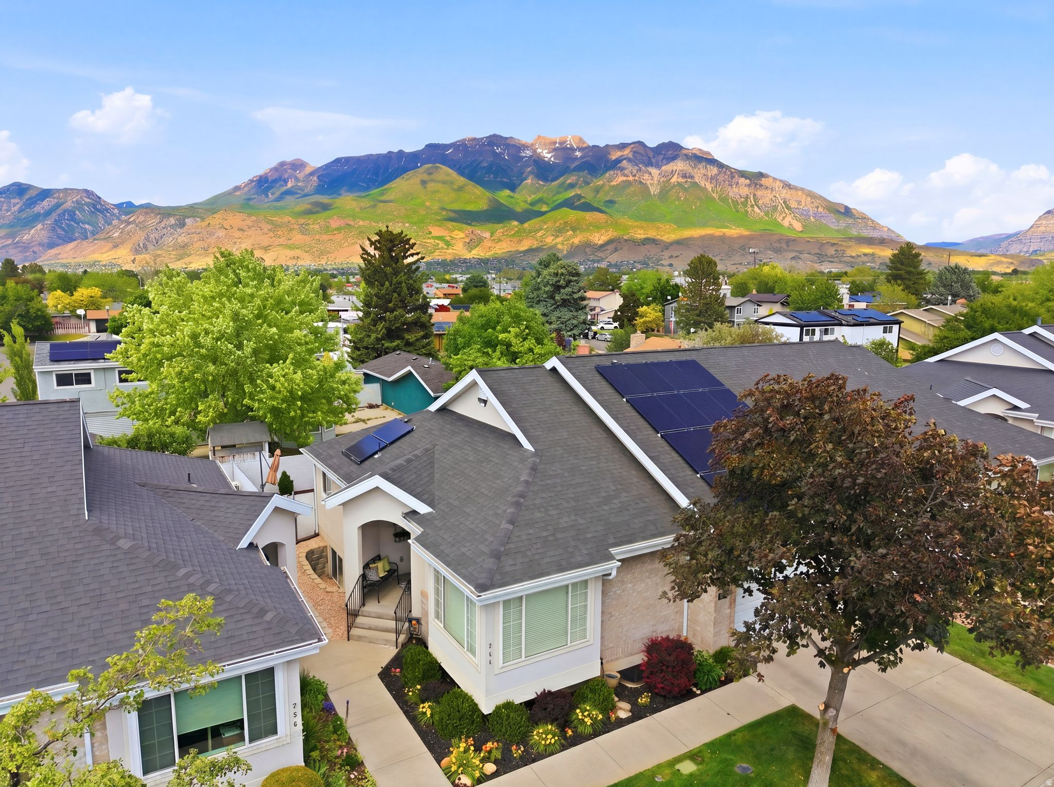 This beautifully updated home blends thoughtful upgrades with everyday functionality in a prime location with quick access to I-15 and the mountains. Offering comfortable main-level living and tasteful updates throughout, this home would be an ideal fit for someone seeking a quieter, low-maintenance lifestyle, including those looking for a 55+ feel without the restrictions of a 55+ community. The fully customized kitchen is the centerpiece of the home, featuring soft-close drawers, pullout shelves in the cabinets and pantry, a built-in spice cabinet beside the stove, pullout trash and recycling, farmhouse sink with integrated cutting board, under-cabinet lighting, illuminated upper glass cabinets, and a full tile backsplash extending to the ceiling. A powerful 3.0 HP garbage disposal and quality finishes throughout make the space both stylish and functional. Additional recent updates include a new Andersen sliding patio door, new water heater, updated backyard patio and landscaping, replaced solar inverter, newer main-level flooring including laminate hardwood and carpet, and a beautifully updated primary bathroom. This home has been exceptionally cared for and offers the perfect blend of comfort, convenience, and thoughtful design.