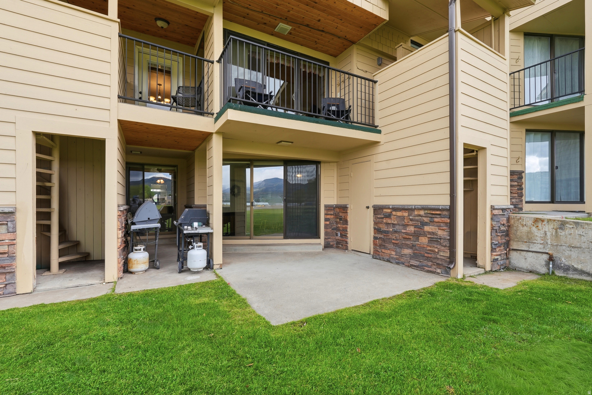 Prime Bear Lake retreat opportunity with direct walkout access to the grass, beach, lake views, and neighboring units also available for a rare multi-unit ownership setup. This fully furnished main-level combination features 2 bedrooms, 2 full bathrooms, spacious living area, full kitchen, patio, and beautiful mountain and lake views. Recently updated with a brand-new metal roof and currently participating in the established rental pool with strong summer bookings already in place. Buyer to honor existing rental pool participation through the current rental term ending September 7, 2026. An outstanding opportunity for personal use, investment potential, or for multiple families looking to secure adjoining units together in one of Garden City's most desirable resort locations. ***Square footage figures are provided as a courtesy estimate only and were obtained from county records. Buyer is advised to obtain an independent measurement.