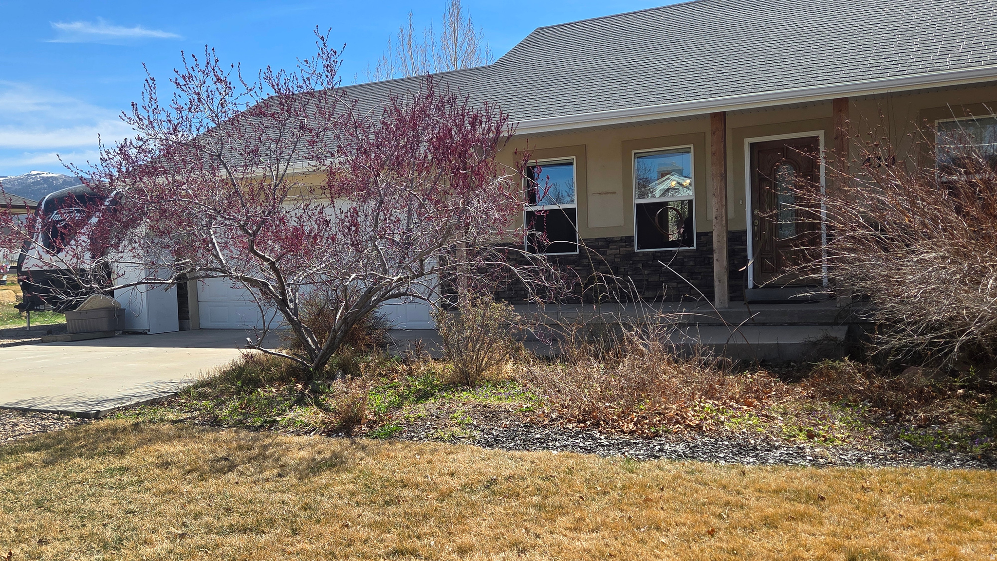 This "cozy meets spacious" cottage home in Mt. Pleasant is perfect blend of private country living & modern comfort. It is located on a quiet street with no through traffic on nearly 1/2 acre of fully landscaped yard with native pines, mature trees & charming garden pathways. It is a gardener's dream, featuring an old granary-style storage shed & pressurized irrigation. The lot also includes a large driveway with plenty of room for RV parking. Main level has open concept layout that feels bright & airy with vaulted ceilings, lots of natural light yet is cozy with a gas log fireplace & new carpet. It has new carpeting & beautiful hardwood. Appliances include dual fuel double oven range, microwave, dryer, but no washer or fridge. 3 bdrms on main floor include a master/ensuite bdrm with walk in closet & jetted tub. The finished basement adds significant value with a large family room set up for a pellet stove,  Also, 2 additional bdrms, bth, an office/craft den all with new carpeting, & beautiful tile work.  Storage room & cold storage as well. Water softener, water heater & furnace with cen. a/c are located in basement utility room.  Property is being sold AS-IS & is & is move in ready. This really is a MUST SEE. Pictures of the backyard are from summer of 2025.