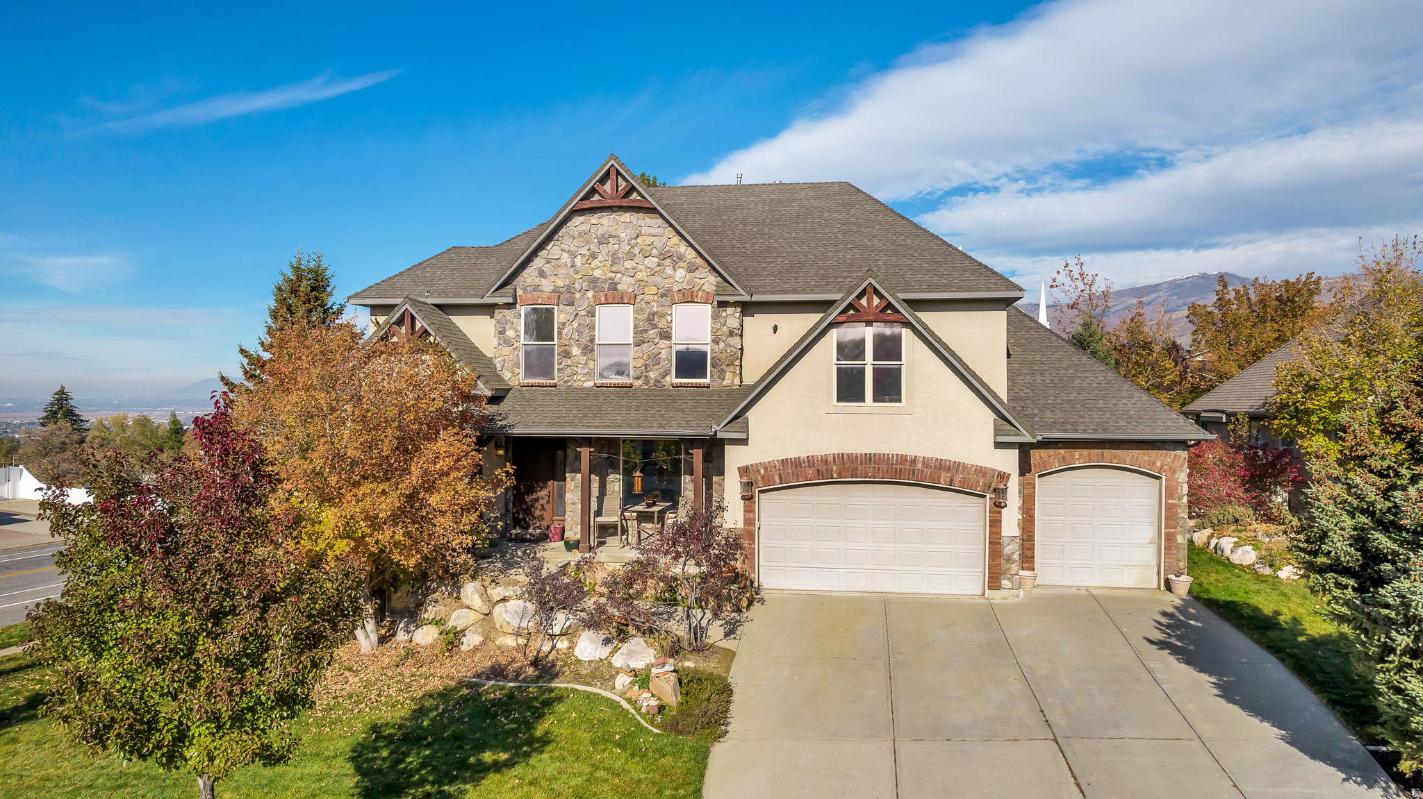 Step into a bright and welcoming home filled with natural light and thoughtfully designed living spaces. The main floor offers an open-concept layout that seamlessly connects the living, dining, and kitchen areas, making it ideal for both everyday living and entertaining. The inviting living room features a cozy gas fireplace, perfect for relaxing during Utah's colder months. The kitchen is designed to impress, showcasing granite countertops, abundant cabinetry, a large center island, stainless steel appliances, and a spacious pantry for added storage. Upstairs, the primary suite provides a comfortable retreat with a walk-in closet and a private ensuite bathroom. Two additional bedrooms and a full bathroom complete the upper level. The finished basement adds valuable flexibility, offering space for a family room, home office, gym, or recreation area. The home also includes two brand-new water heaters and a water softener. Outside, you'll discover a private backyard retreat where you can unwind and enjoy the peaceful surroundings. A spacious nine-person hot tub is included, creating the perfect setting for relaxation and outdoor enjoyment
