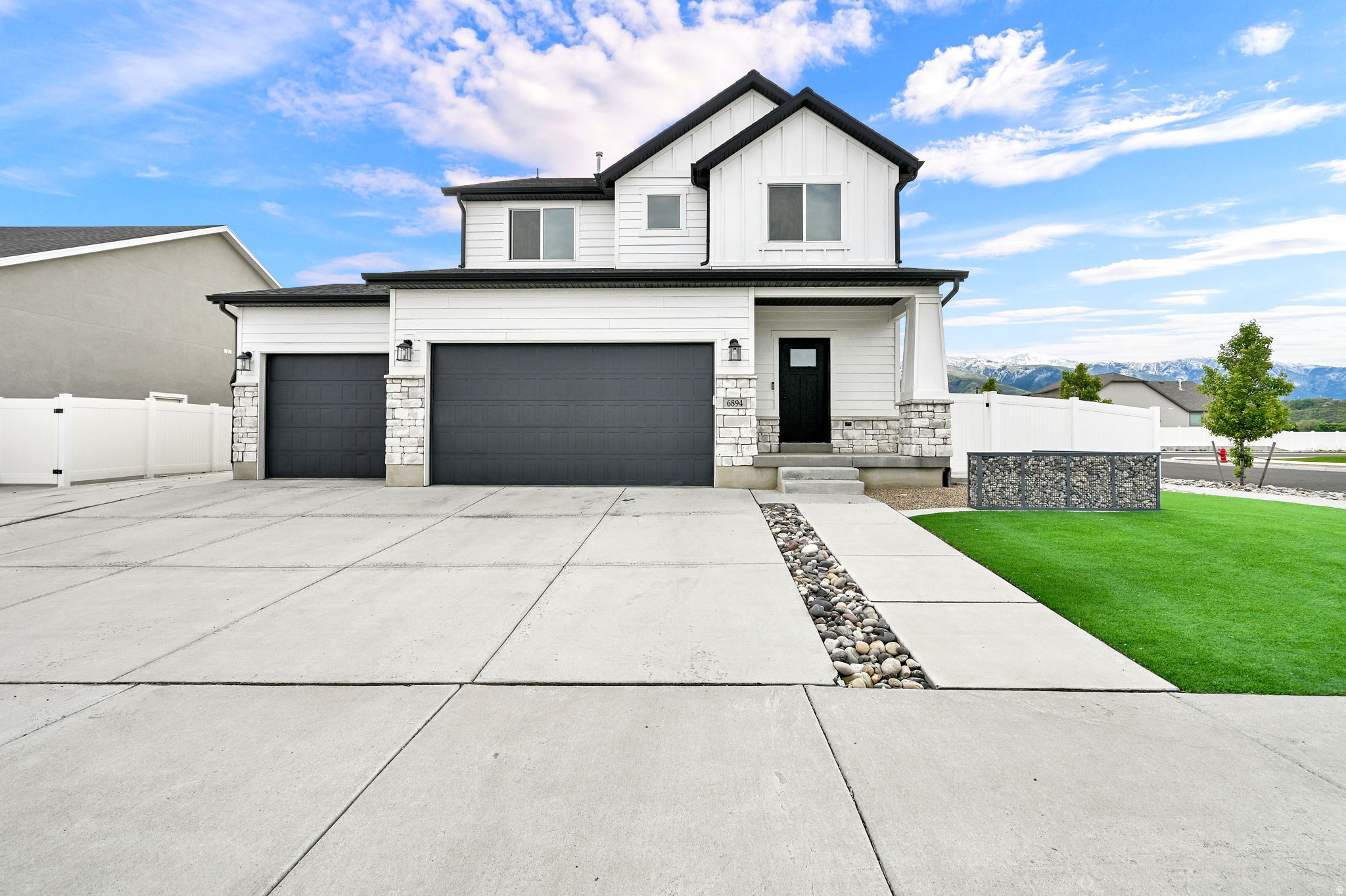 This beautiful and stylish two-story home is ready for new homeowners! Located in the heart of South Weber, you'll be within minutes of world-class skiing, fine dining, local entertainment, and just 25 minutes from the Salt Lake International Airport. Designed for both comfort and entertaining, this home is the perfect gathering place for family and friends. Host unforgettable summer BBQs and create lasting memories in the inviting outdoor space. The home also features a separate entrance to a fully finished basement apartment, offering excellent potential for an income property, guest suite, or multi-generational living. Extra parking provides plenty of room for your RV, boat, trailers, and more. With a layout that feels both functional and welcoming, this home is easy to show and even easier to love!
