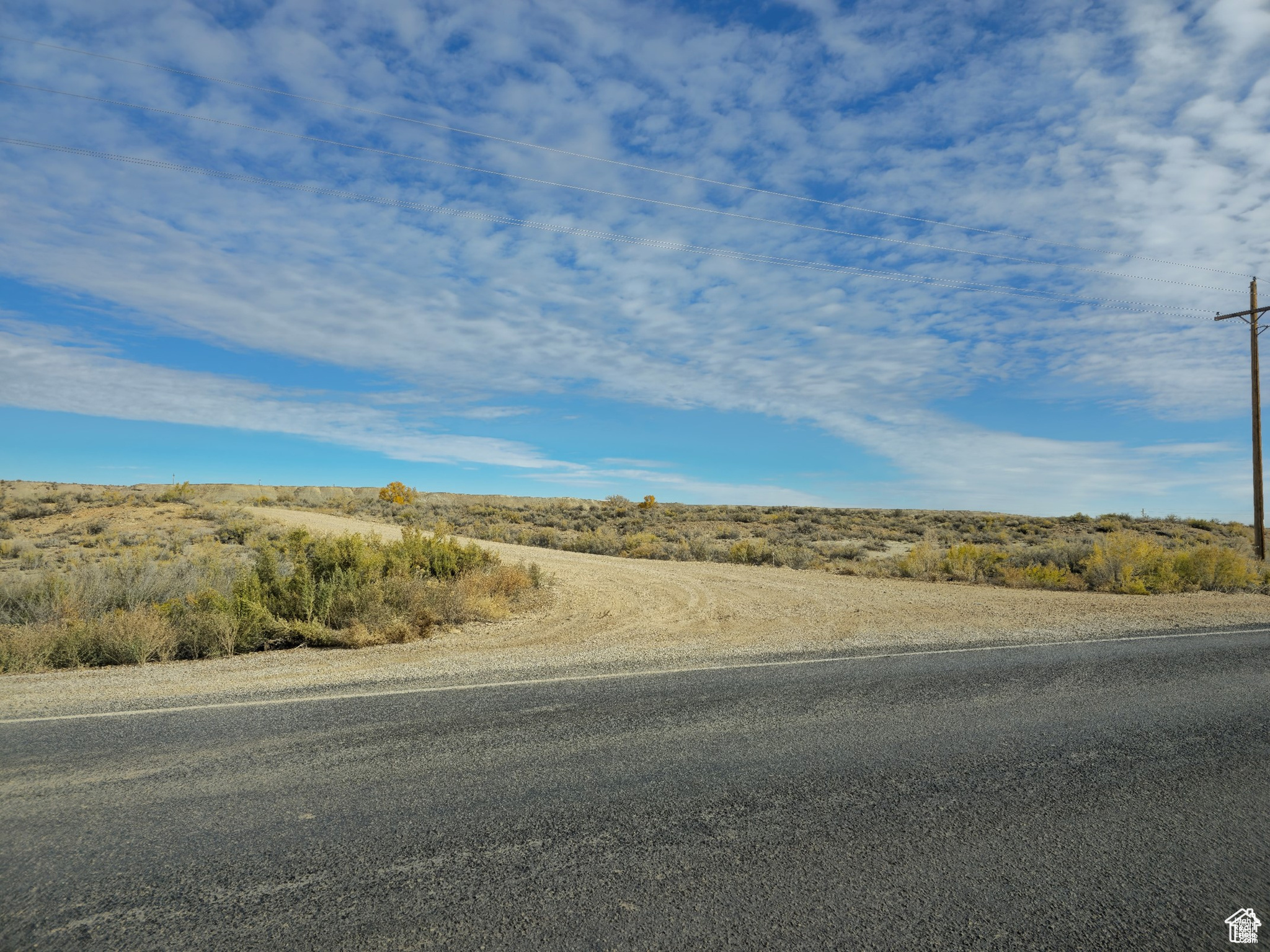 Prime 50-acre Commercial Development opportunity! This expansive 50 acre parcel presents a unique opportunity for commercial development. Strategically located with water access, power lines on two sides and convenient fire hydrant access, this property offers exceptional infrastructure for a variety of commercial ventures. Don't miss this rare chance to secure a premier commercial development site!