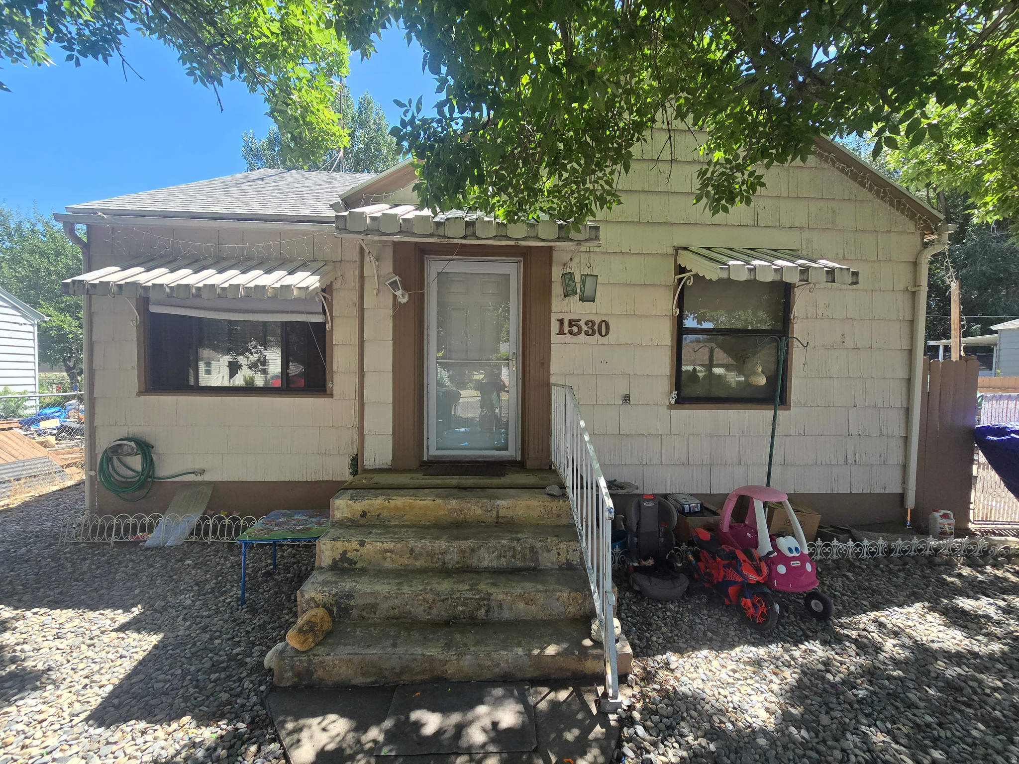 INVESTORS TAKE A LOOK! This 4 bedroom home with 2 baths (bath in basement is not currently usable) has  a large, fenced yard. Irrigation water and a oversized two car garage with a woodstove and swamp cooler. Plenty of parking with possible RV and trailer parking. It needs some TLC but priced well below market value to give you the room to update etc. There will be two open windows to take a look: Monday 7/20 from 4-6pm and Tuesday 7/21 from 4-6 pm at which time seller will assess any offers.