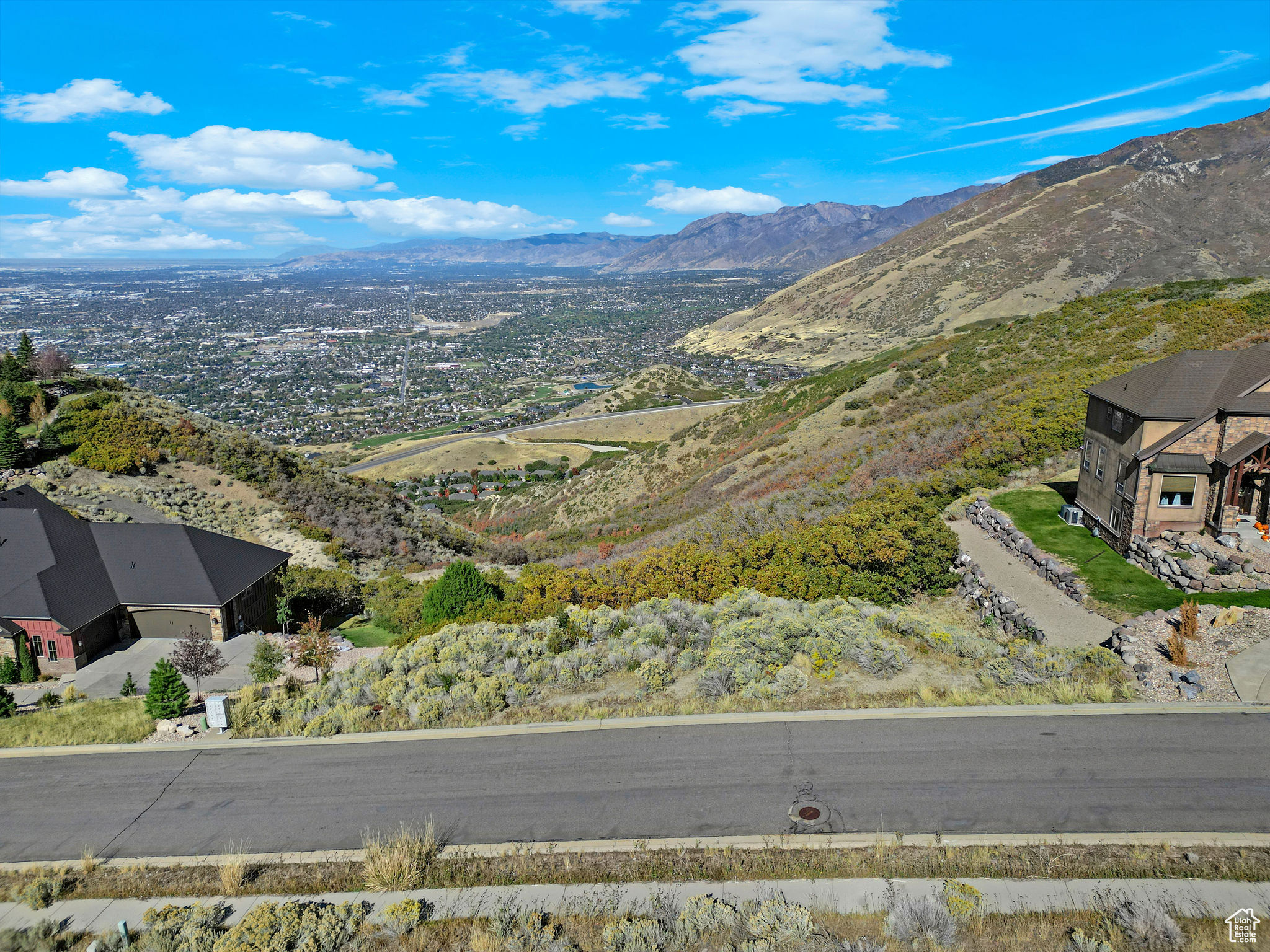Experience luxurious, peaceful mountain living with breathtaking, million-dollar panoramic views of the Salt Lake Valley and the majestic Utah mountains. This rare 0.90-acre lot is perfectly nestled between two stunning homes in the highly sought-after Suncrest community. It's one of the last remaining unobstructed view lots-an ideal canvas to build your custom dream home with the builder of your choice. Perched at the top of the mountain, you'll enjoy direct access to endless hiking and biking trails, all while being just minutes from downtown Draper and the thriving Silicon Slopes tech hub in Lehi. As part of the Suncrest master-planned community, you'll also enjoy exclusive amenities including scenic trails, a community pool, basketball courts, and a fully equipped fitness center. Don't miss this opportunity to own a slice of mountain paradise-where luxury meets adventure. Square footage figures are provided as a courtesy estimate only, buyer is advised to obtain an independent measurement and verify all information.