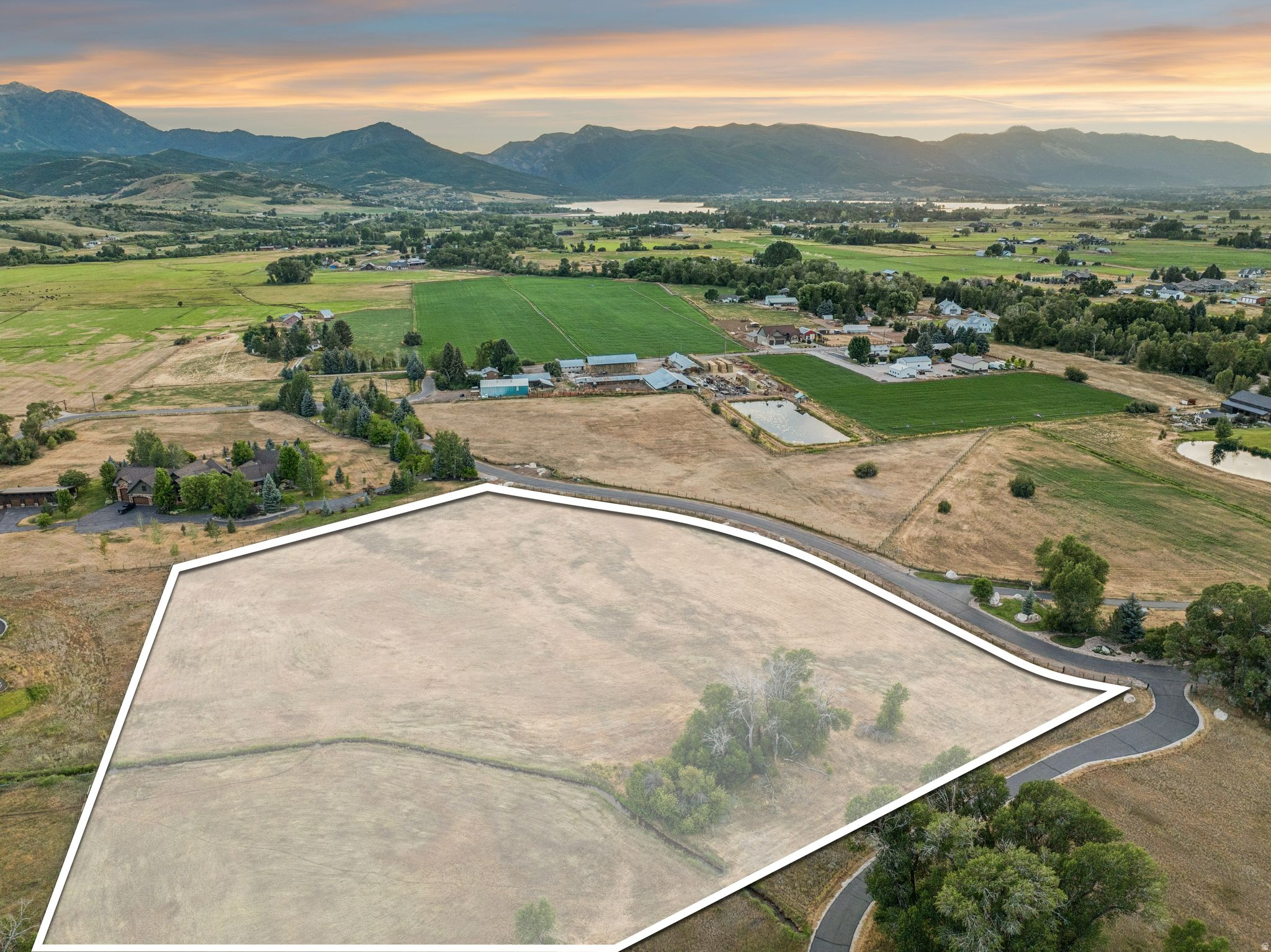 Framed by panoramic mountain views and surrounded by peaceful open space, this exceptional 6.8-acre homesite in River Ranch Estates offers the kind of privacy and serenity that's becoming increasingly rare. Nestled among expansive ranches and luxury estates, this is more than a place to build, it's an opportunity to create a legacy in one of Ogden Valley's most coveted communities. With 2 valuable water shares and minimal CC&Rs, you'll enjoy the flexibility to design the retreat you've always envisioned while preserving the beauty and character of the neighborhood. Whether you're dreaming of horses, a custom estate, or simply room to breathe, this property offers the space and setting to make it a reality. Just minutes from Pineview Reservoir, Snowbasin Resort, Powder Mountain, and charming downtown Huntsville, this is mountain living at its finest.