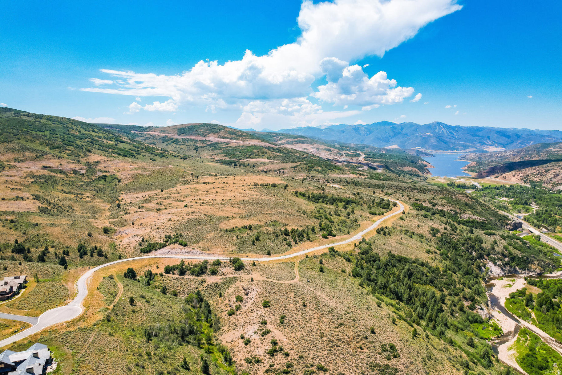 Set across more than 45 acres in the coveted River Ranch Collection, Homesite 180 is one of Victory Ranch's most extraordinary legacy opportunities. With a remarkable 643,300-square-foot building envelope and two designated building pads, this exceptional property offers an unparalleled canvas for creating a private mountain estate unlike anything else within the community.  The primary east-facing homesite is perfectly positioned to capture breathtaking views up the Upper Provo River corridor and the dramatic Rock Cliffs, allowing for a custom residence of up to 11,000 square feet. A secondary homesite offers the opportunity to build an additional residence of up to 2,500 square feet while enjoying spectacular west-facing sunsets toward Deer Valley-ideal for a guest home or caretaker's residence.  Few properties within Victory Ranch offer this combination of acreage, flexibility, and commanding views, making Homesite 180 an exceptional setting for a private family retreat or a multigenerational legacy estate designed to be enjoyed for decades to come. Victory Ranch is a private, four-season community encompassing 6,250 pristine acres and four miles of the Upper Provo River. Residents enjoy an unparalleled collection of world-class amenities, including the acclaimed Rees Jones championship golf course, exceptional fly fishing, miles of hiking and mountain biking trails, 5-stand shooting, off-road adventures, snowmobiling, backcountry yurts, fishing ponds, multiple dining venues, and a private ski-in/ski-out lodge in Park City. The community continues to set the standard for luxury mountain living with The Post Clubhouse, featuring concierge services, a heated pool, hot tubs, fire pits, and seasonal dining, alongside The Barn-Victory Ranch's signature family gathering place-offering a fitness center, spa, indoor basketball and sport court, platform tennis, art studio, game room, pizza and ice cream parlor, swimming pool with waterslide, tranquil stream, event lawn, and endless opportunities for recreation in every season. Located just 15 minutes from Deer Valley and approximately 20 minutes from Historic Park City, Homesite 180 offers the rare chance to build not simply a home, but a destination where generations of family and friends will gather for years to come.