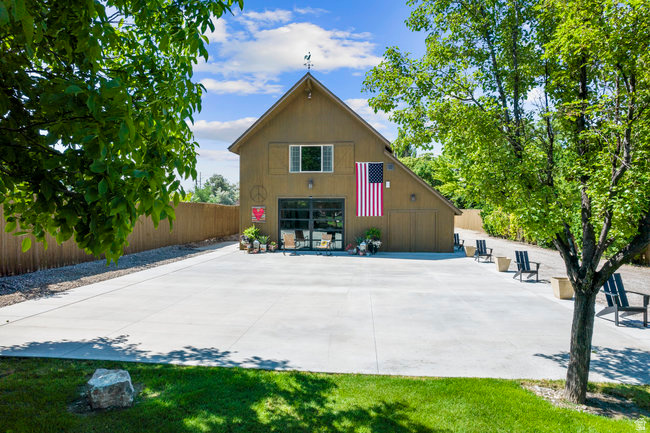 An exceptional opportunity to acquire a commercially zoned, income-producing multi-use property in one of Provo's premier commercial corridors. Situated on 1.154 acres, this unique investment features a beautifully converted 3,328-square-foot barndominium currently operating as a successful short-term rental and event venue, along with a separate 1900 sq. ft. duplex generating approximately $2,500 per month in stable rental income. The property also includes a 1,400-square-foot garage and generous storage space for equipment, inventory, event supplies, or business operations. With 42 on-site parking spaces, expansive outdoor areas, and a flexible layout, the property is well-positioned to accommodate private events, boutique weddings, corporate gatherings, and a variety of commercial ventures.  Recently approved for commercial (conditional use), this turnkey property offers immediate cash flow with significant upside as demand continues to grow for distinctive venue spaces throughout Utah County. The combination of commercial zoning, multiple established income streams, generous storage, ample parking, and room to expand creates a rare investment opportunity for owner-users and investors alike. Properties with this level of versatility and growth potential seldom become available.  Square footage figures are provided as a courtesy estimate only and were obtained from county records buyer is advised to obtain an independent measurement.