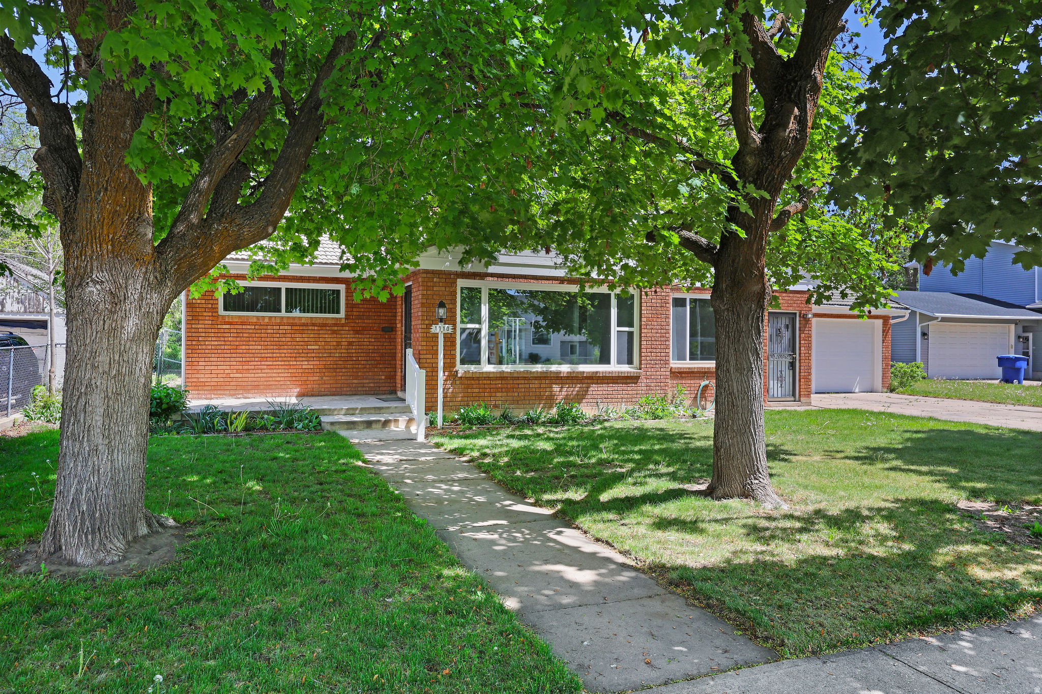 Beautiful and well loved home, offers both comfort today and opportunity for tomorrow.  New windows,  2 New Garage Doors,  Freshly painted and all appliances stay with the property.  Welcome to this bright and inviting Ogden property, ideally located just minutes from downtown amenities.  Step inside and you'll immediately appreciate the open, airy feel created by the abundance of natural light streaming through the newer windows. Refinished original hardwood floors add warmth and character, while the thoughtfully designed single-level floor plan offers easy, convenient living with no stairs to navigate.  The furnace has recently been serviced, giving buyers added peace of mind, and the oversized detached garage features **two brand-new garage doors with remotes** for added convenience.  Outside, the spacious yard offers room to garden, entertain, play, or simply enjoy the outdoors. Included water shares add tremendous value and flexibility for maintaining the property.  Here's where this property truly stands apart: **Ogden City has indicated that an approximately 800-square-foot Accessory Dwelling Unit (ADU) could be built in the backyard.** Whether you're looking for multigenerational living, guest quarters, a home office, or rental income potential, this property offers an exciting opportunity for buyers seeking a true "house hack" investment.