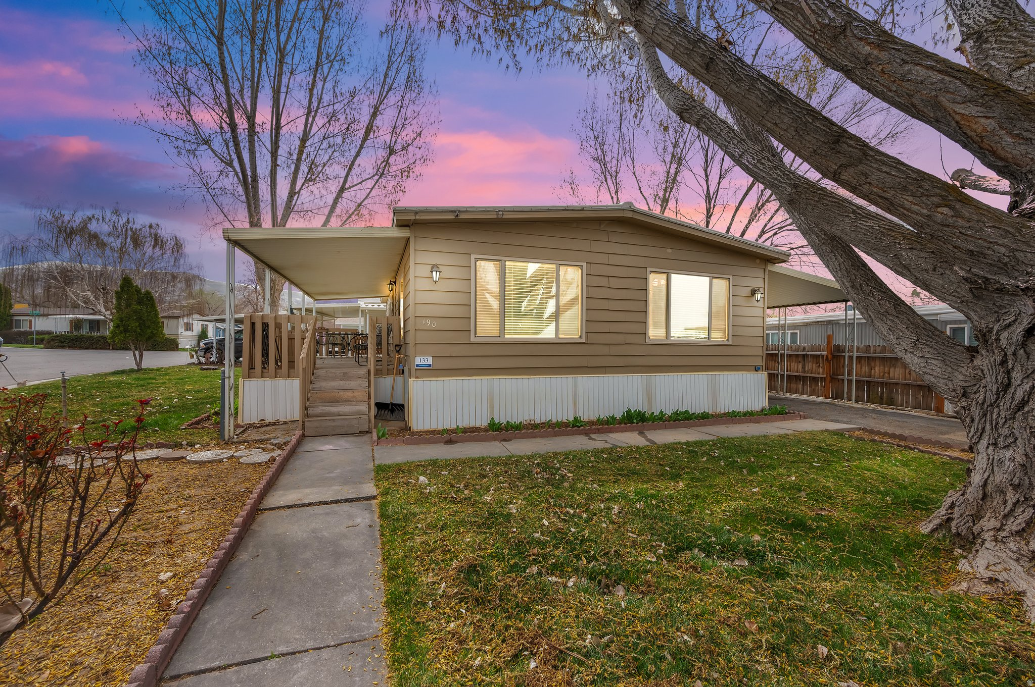 Discover comfort and affordability in this beautifully updated 3-bedroom, 1-bathroom double-wide mobile home, located in the desirable Camelot Mobile Home Park in North Salt Lake, Utah. Featuring a spacious interior, this home has been upgraded with elegant tile flooring, sleek granite countertops, and fresh paint throughout, giving it a modern and inviting feel. Additionally, a brand-new water heater ensures efficiency and reliability. Enjoy the convenience of ample living space, a well-equipped kitchen, and cozy bedrooms. Located in a welcoming community with easy access to shopping, dining, and major highways, this home offers an excellent opportunity for comfortable living at an affordable price. The community has many amenities, including a lot as an option for the storage of your RV or boat. (Buyer to verify all information)