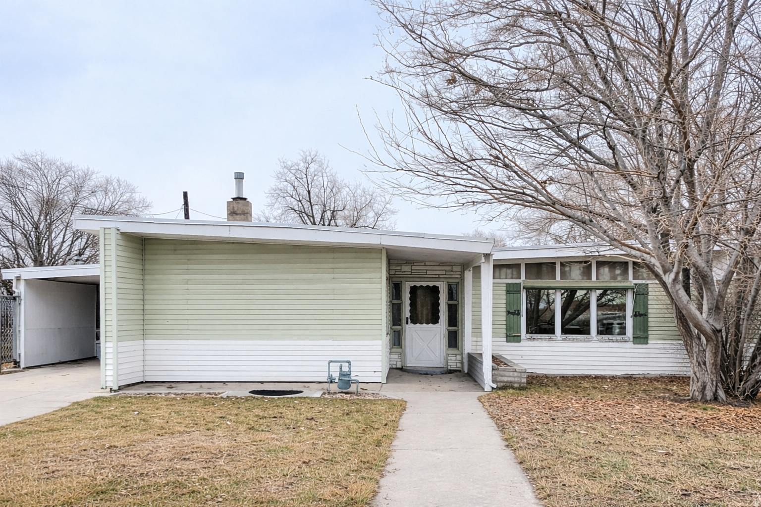 Welcome home to this charming 3-bedroom, 1-bath gem offering comfortable single-level living in a warm, inviting layout perfect for everyday living. Outside, you'll love the large carport plus a 2-car detached garage and tons of outdoor storage - ideal for vehicles, tools, and hobbies. The nicely fenced yard is ready for pets, play, or relaxing evenings. Cute, cozy, and full of potential - this one is a must-see!   Square footage figures are provided as a courtesy estimate only and were obtained from County records.  Buyer is advised to obtain an independent measurement.