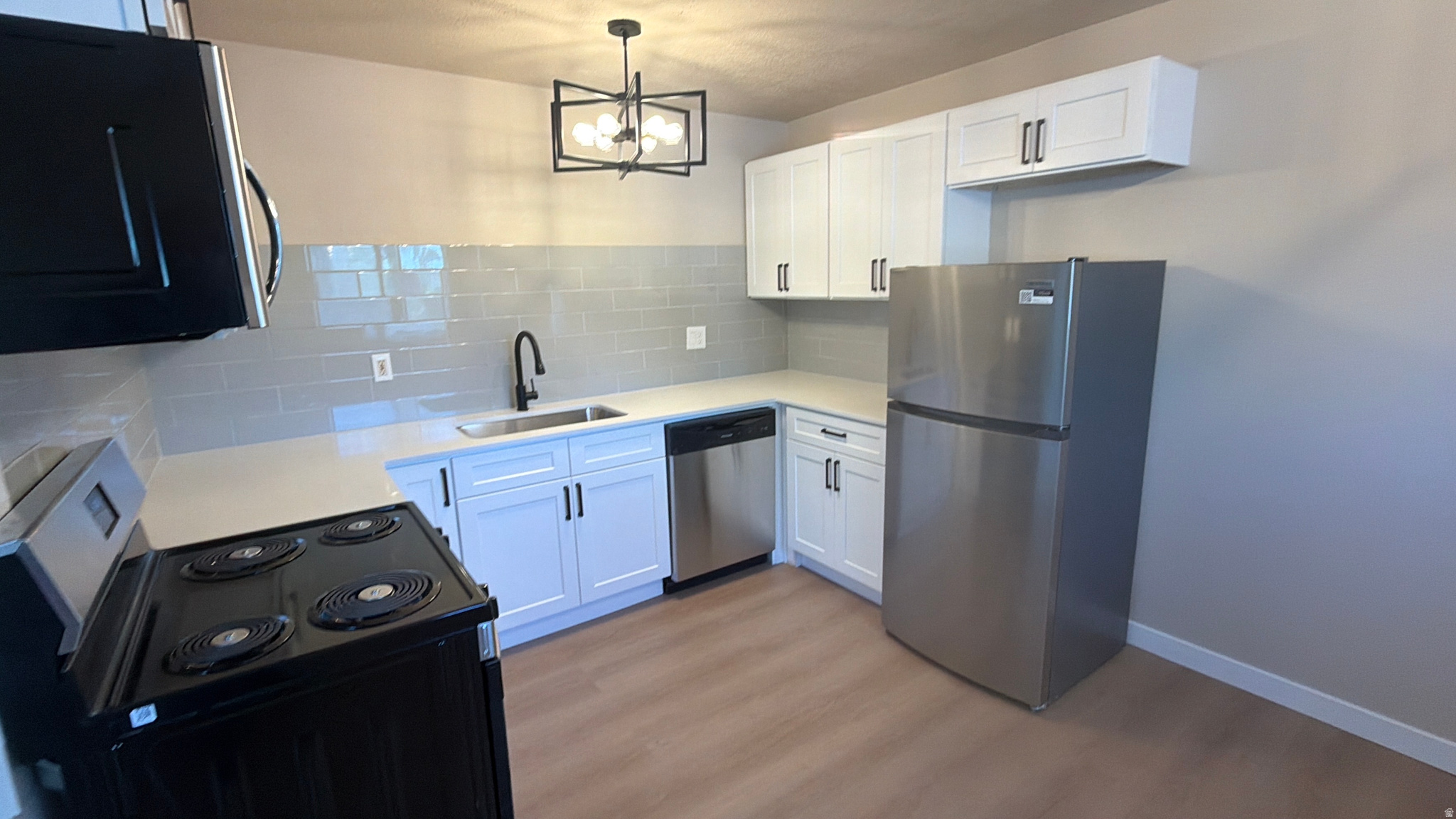 Well done remodeled unit with new and updated kitchen and bathroom.  Newly painted walls, lighting, and flooring installed.  Beautifully done. Great location with an HOA that covers sewer, water, garbage.