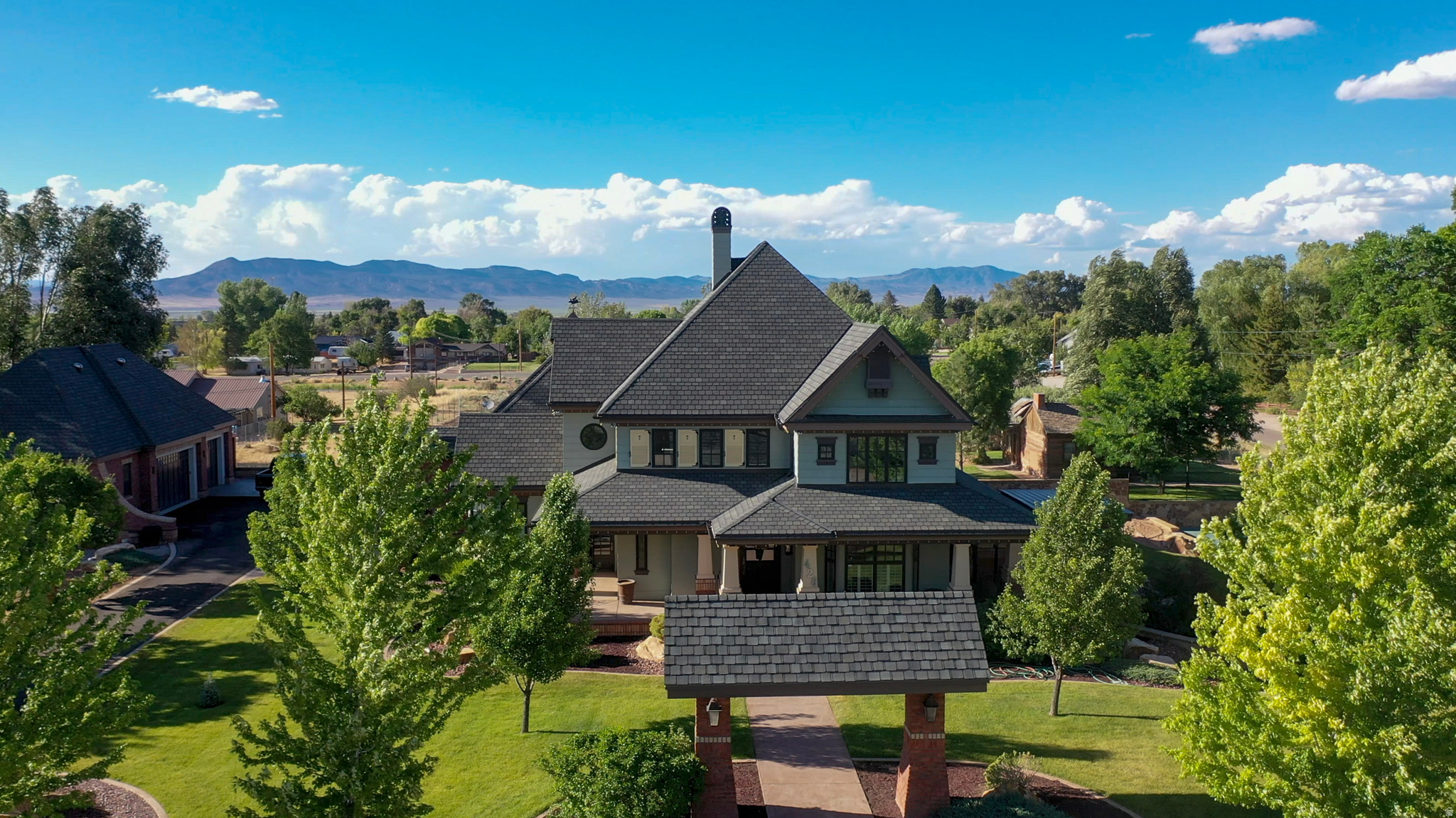 Grand Victorian Estate with Exceptional Multi-Generational Living Step into timeless elegance with this stunning custom Victorian estate, offering over **7,000 square feet** of beautifully designed living space on a sprawling **0.81-acre corner lot**. Perfectly suited for multi-generational living, this one-of-a-kind property features **two full kitchens**, providing flexibility, privacy, and convenience for extended family, guests, or entertaining on a grand scale. The home's impressive Victorian architecture showcases classic charm blended with modern functionality. Spacious living areas, generous bedrooms, and distinctive architectural details create an inviting atmosphere throughout. Whether hosting large gatherings or enjoying everyday living, this residence offers room for everyone.Car enthusiasts, hobbyists, and those needing additional storage will appreciate both the **attached garage** and the **detached garage**, providing ample space for vehicles, workshops, recreational equipment, and more.Situated on a desirable corner lot with mature landscaping and expansive outdoor space, this remarkable property offers endless possibilities for gardening, recreation, and outdoor entertaining.**Property Highlights:*** Custom Victorian home with exceptional character and craftsmanship* Over 7,000 square feet of living space* Ideal multi-generational floor plan* Two full kitchens* Attached and detached garages* Expansive 0.81-acre corner lot* Generous room sizes and abundant storage* Perfect for large families, entertaining, or flexible living arrangementsA rare opportunity to own a truly extraordinary home that combines elegance, space, and versatility in one exceptional property.