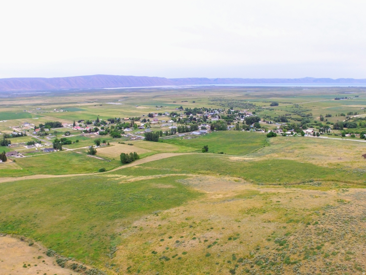 Discover 6.57 acres overlooking the scenic Bear Lake Valley, located just west of the city limits of Bloomington in Bear Lake County. This exceptional property offers breathtaking panoramic views of Bear Lake and the surrounding mountain landscape, making it an ideal retreat for recreation, camping, or a seasonal cabin getaway.  The property features no HOA fees and no CCR restrictions, providing flexibility and freedom for your vision. Access is provided through a recorded easement from North 3rd Street to the northeast side of the parcel. The western boundary adjoins Idaho State land, with National Forest access just a short drive up Bloomington Canyon, offering endless opportunities for outdoor adventure including hiking, ATV riding, hunting, and wildlife viewing.  This secluded parcel is accessed seasonally and currently has no utilities, preserving its peaceful and off-grid appeal. Wildlife is abundant throughout the area, adding to the property's natural charm and recreational value.  Whether you are seeking a private mountain escape, recreational property, or future getaway site, this Bear Lake County acreage offers outstanding views, privacy, and access to Idaho's beautiful outdoors.