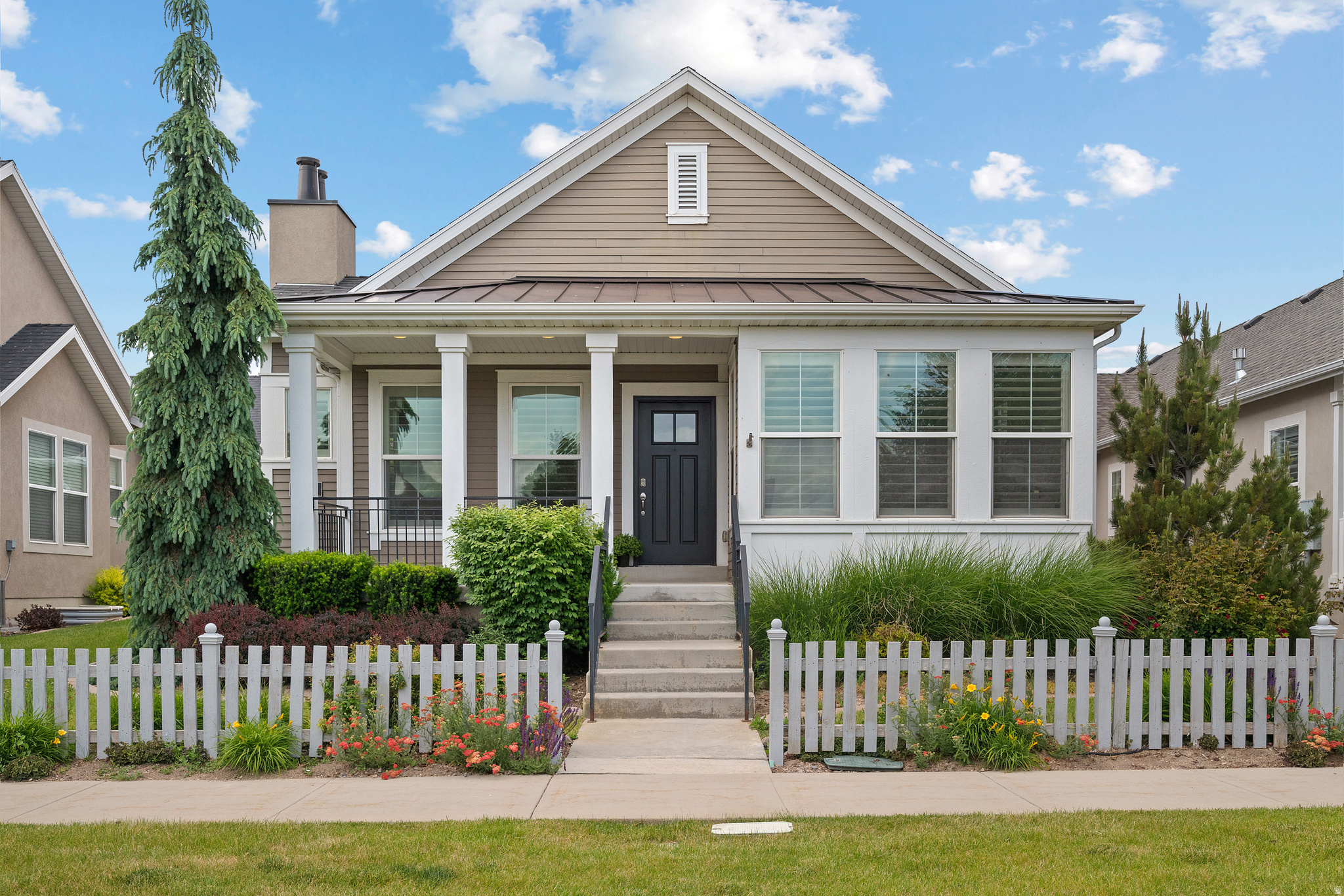 Welcome to this beautifully maintained and thoughtfully designed home nestled in a unique and amazing neighborhood that offers charm, comfort, and an exceptional sense of community. From the moment you arrive, you'll appreciate the stunning curb appeal, spacious three-pillar covered front porch, and meticulously cared-for yard that create a warm and inviting first impression.  Inside, the open offers a spacious floor plan for comfortable living with modern finishes throughout. The great room features vaulted ceilings, gorgeous LVP flooring, and a cozy gas fireplace, creating the perfect gathering space. The beautifully appointed kitchen showcases custom white cabinetry, stainless steel appliances, and an inviting dining area large enough to accommodate an oversized table for entertaining family and friends. Plantation shutters, grace, the main floor, and add a touch of elegance to the home.  The main-floor primary suite is a relaxing retreat with a spacious bedroom, private bath featuring double sinks, quartz countertops, a deep soaker tub, walk-in shower, private potty room, and generous walk-in closet, plus additional linen storage. A second bedroom and full bath on the main floor provide flexibility for guests or office space. You'll also love the oversized coat closet, large laundry room with linen storage, and extra-wide two-car garage. The home is also equipped with a built-in radon mitigation system for added peace of mind.  The fully finished basement offers exceptional additional living space with a huge family room, abundant storage, and two spacious bedrooms - including one with an oversized walk-in closet. The basement also features a beautifully finished three-quarter bath with a large tiled walk-in shower and granite countertops. An enormous storage room with additional cold storage under the front porch.  This home is blessed with an over abundance of storage areas.  Step outside to enjoy the side patio with convenient access from the dining room, perfect for barbecues and outdoor entertaining. Every inch of this home has been beautifully finished and lovingly cared for, giving it the feel of a brand-new home.  Located in a truly special neighborhood known for its welcoming atmosphere and distinctive character, this fantastic home offers the perfect combination of quality craftsmanship, spacious living, and timeless appeal. An absolute must-see!