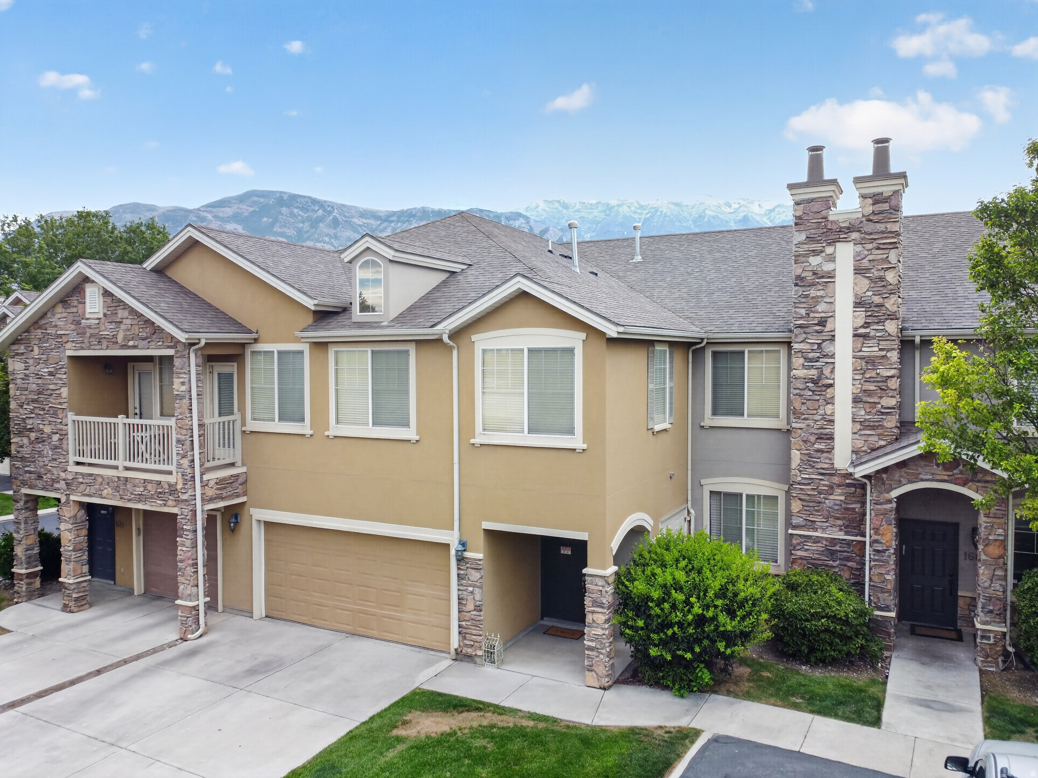 Welcome to one of the largest and most spacious 3-bedroom, 2-bath townhomes in the highly sought-after Pemberley community of Pleasant Grove. Thoughtfully designed for comfortable living, this inviting home features an open-concept floor plan with expansive living areas, vaulted ceilings, and a private balcony perfect for relaxing. The oversized primary suite offers a walk-in closet and a private in-suite bathroom, creating a peaceful retreat. Pride of ownership shines throughout, and the extended 2-car garage provides exceptional storage space for vehicles, outdoor gear, and more.  Enjoy resort-style community amenities including a swimming pool, clubhouse, fitness center, playground, and beautifully landscaped grounds. Conveniently located just minutes from I-15, shopping, dining, parks, top-rated schools, and the Silicon Slopes tech corridor, this home offers the perfect combination of space, comfort, and convenience.