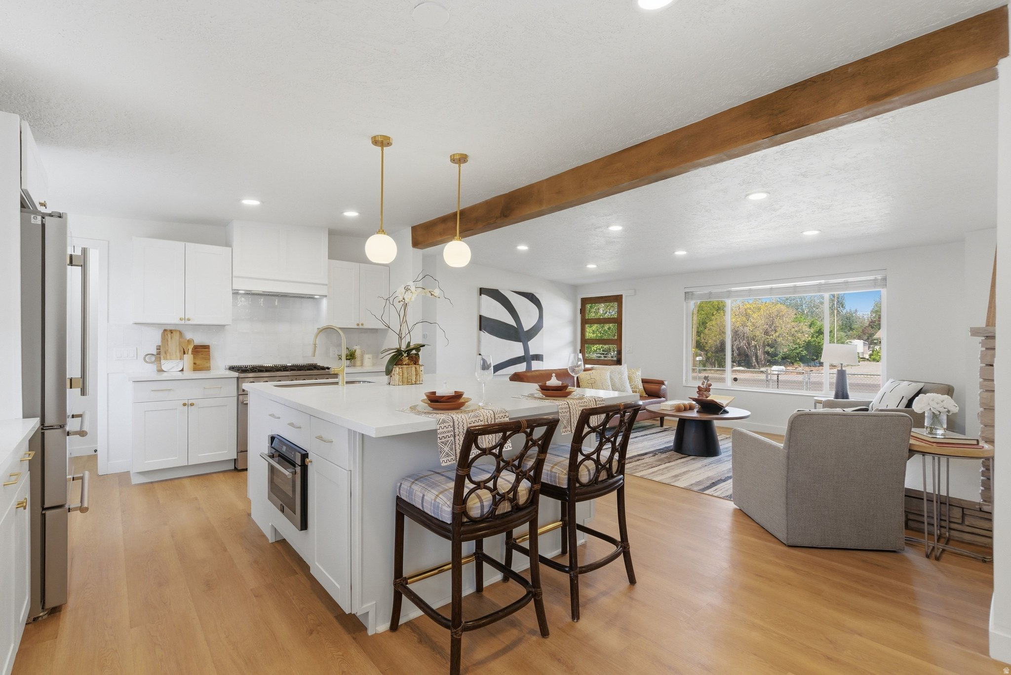 Stunning 3,362 sq ft fully remodeled property with incredible mortgage-helper potential! This massive 6-bed, 4-bath home features a fully equipped, private 1-bedroom suite-perfect for multi-generational families, long-term guests, or roommates to help offset your monthly payment. Enjoy the ultimate layout flexibility. The main living space is bright and open, featuring a chef's kitchen with high-end appliances, oversized windows, and a private master oasis. The connected, above-ground guest wing includes its own living area, bedroom, and bathroom, giving extended family or house-mates total independence under one roof. Skip the school carline with local schools just a short walk away. Located perfectly for quick commuter access across West Valley City, this completely renovated property offers the space, finishes, and financial flexibility you've been looking for.