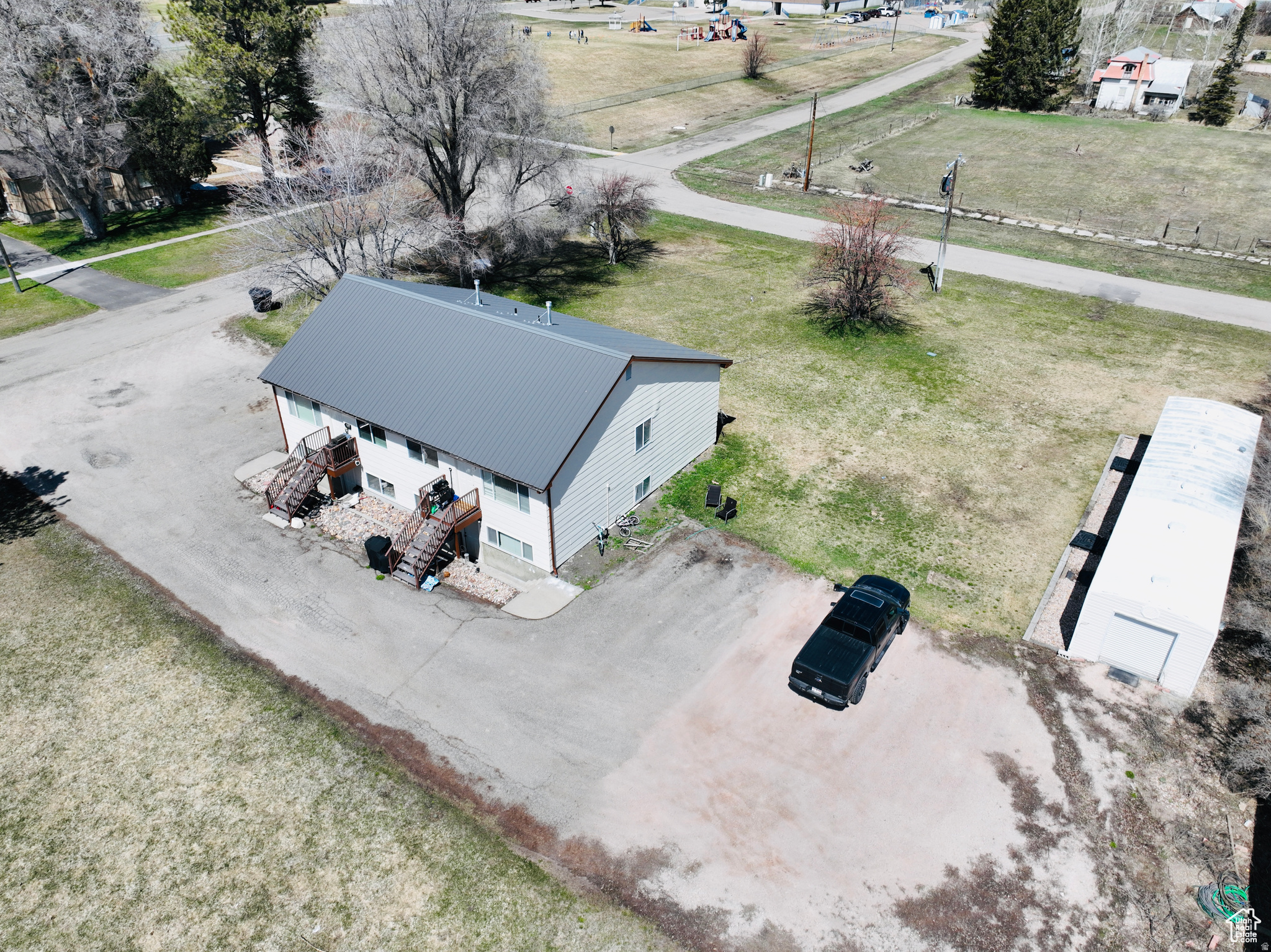 Need employee housing? Looking for a great investment opportunity? Rare Bear Lake opportunity to own your own 4-Plex in Paris ID. No HOA or restrictions this can be used as long term rentals or short term rentals. Each unit is currently rented to full time residence. A storage unit is also on the property and may be rented or used by the tenants. Full sprinkler system and mature lawn. Owner will seller finance the property. Call Listing agent for details on finance option.